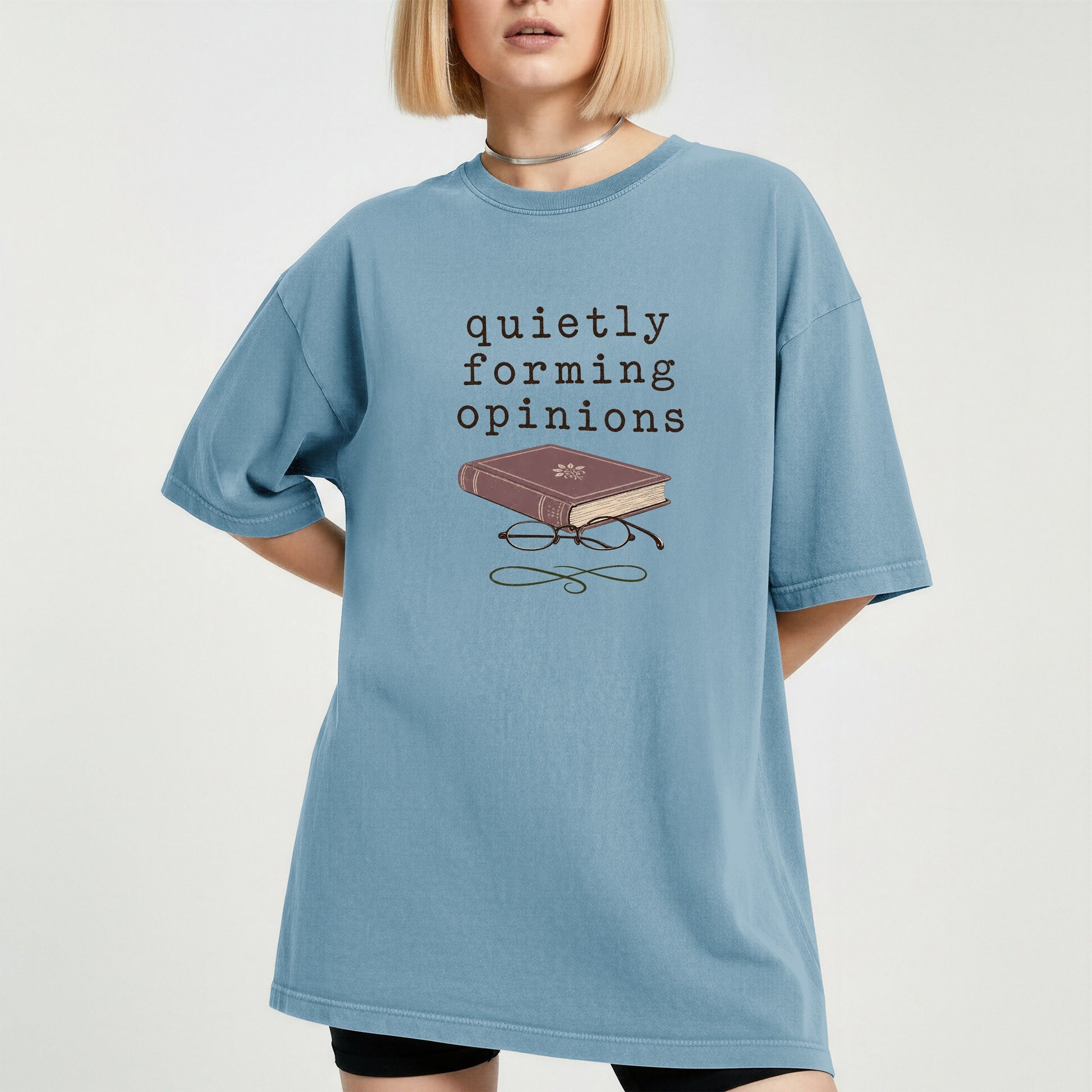 Quietly Forming Opinions bookish tee in Ice Blue, worn