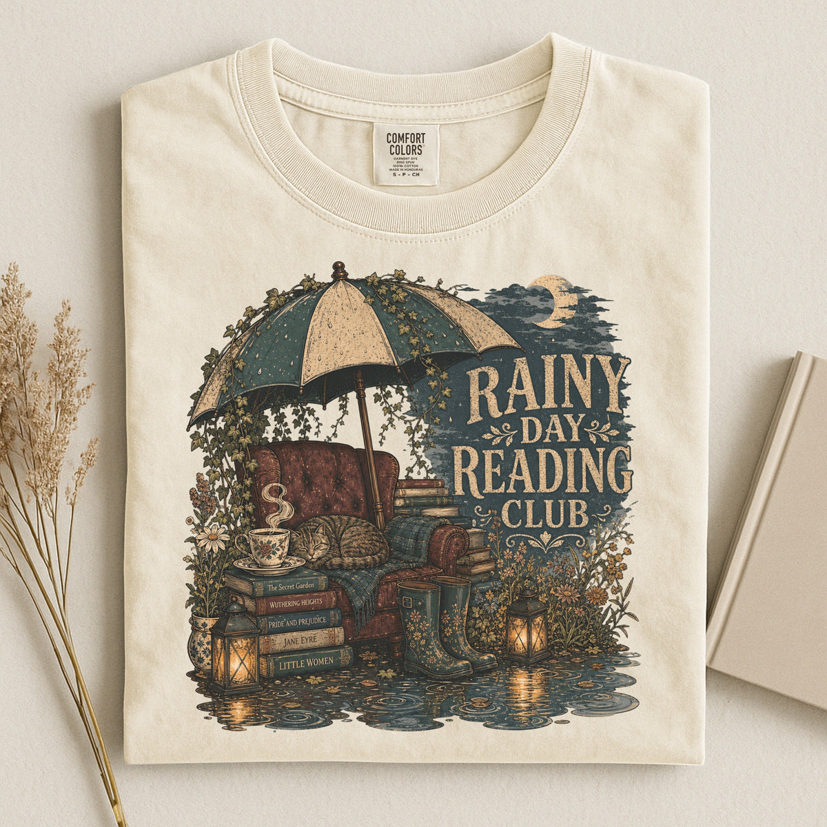 Rainy Day Reading Club bookish tee in Ivory, flat lay