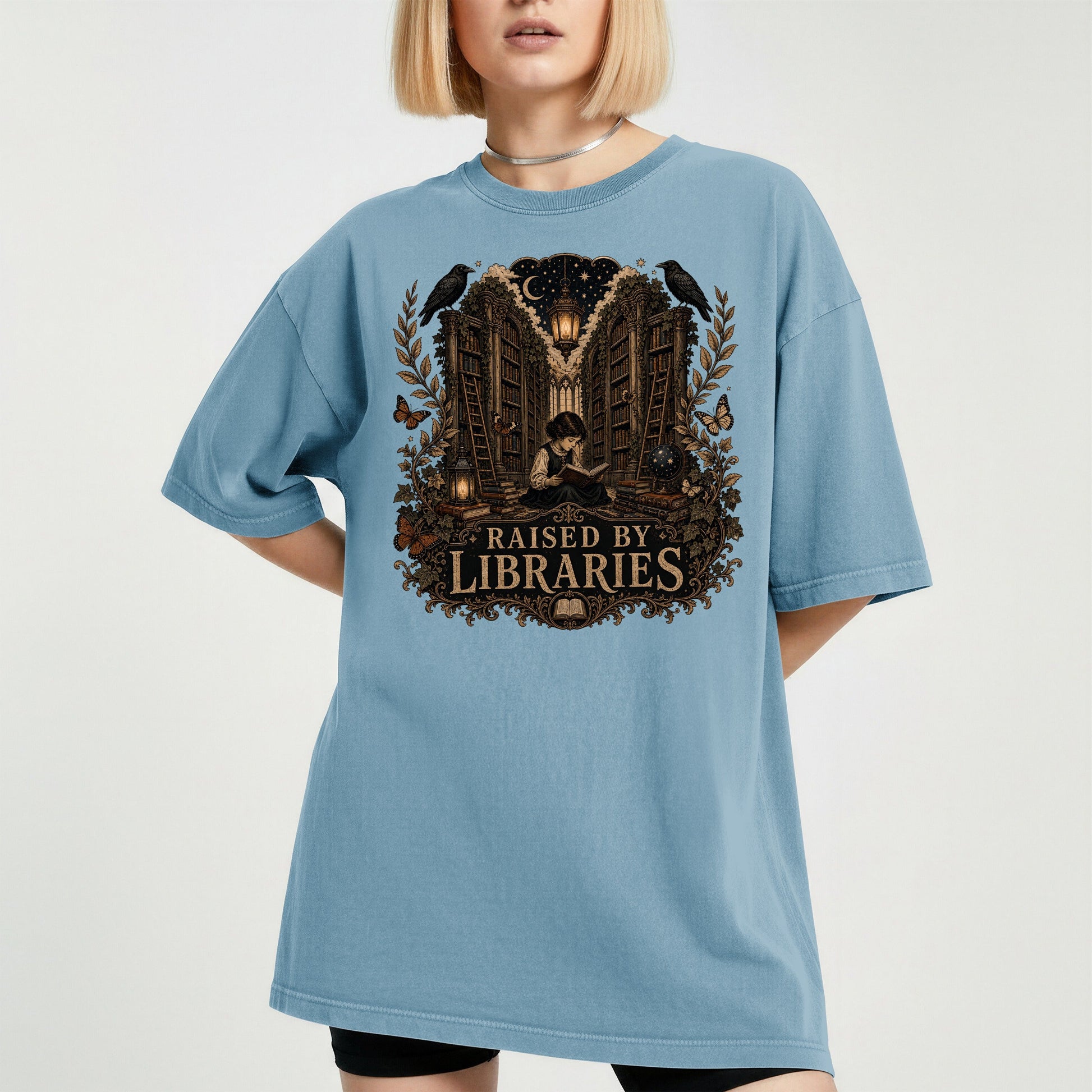 Raised by Libraries bookish tee in Ice Blue, worn