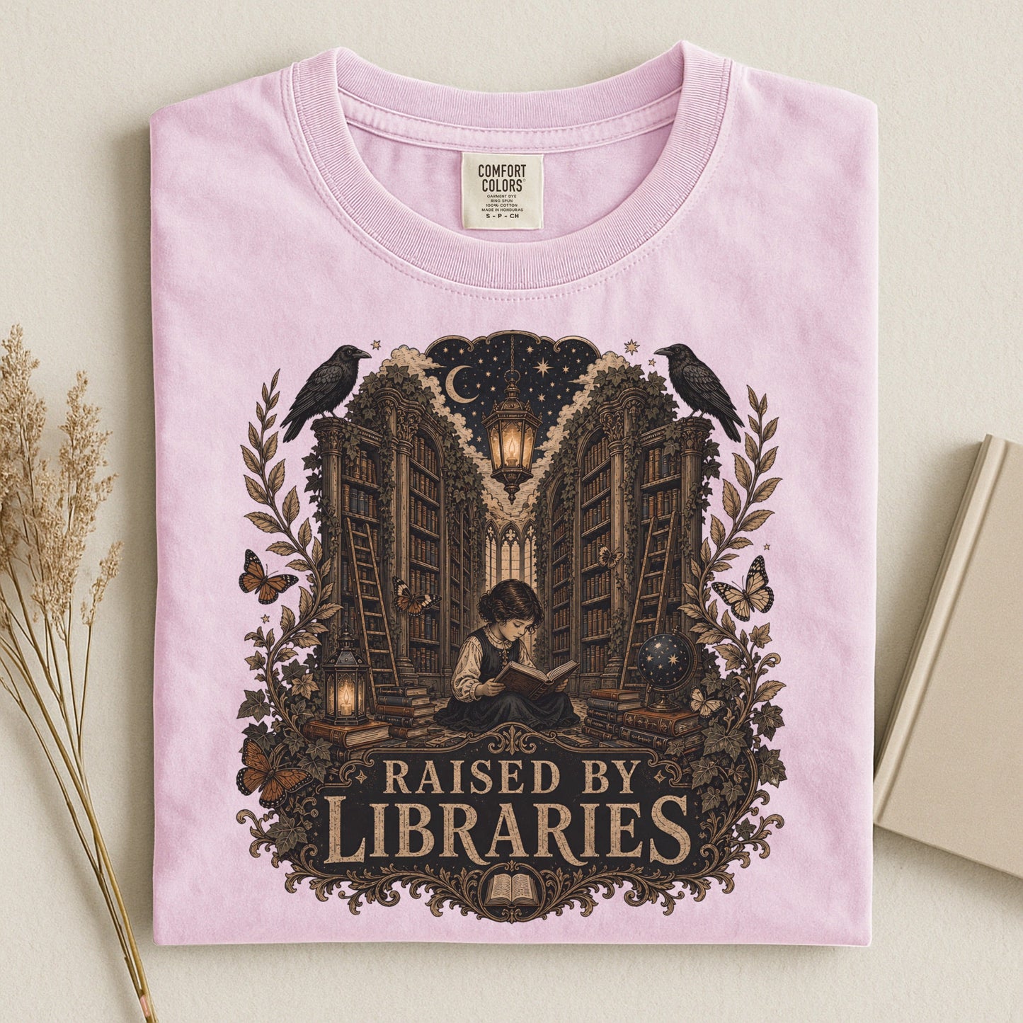 Raised by Libraries bookish tee in Blossom, flat lay