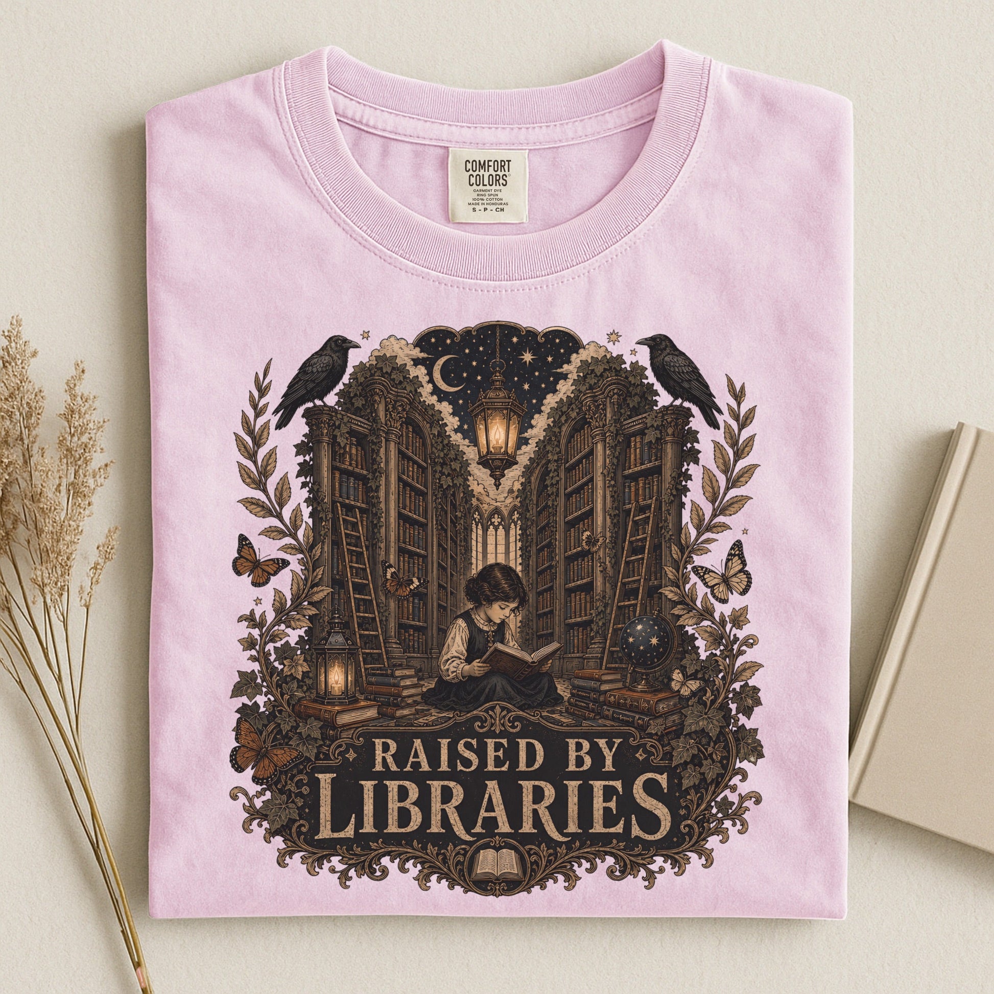 Raised by Libraries bookish tee in Blossom, flat lay