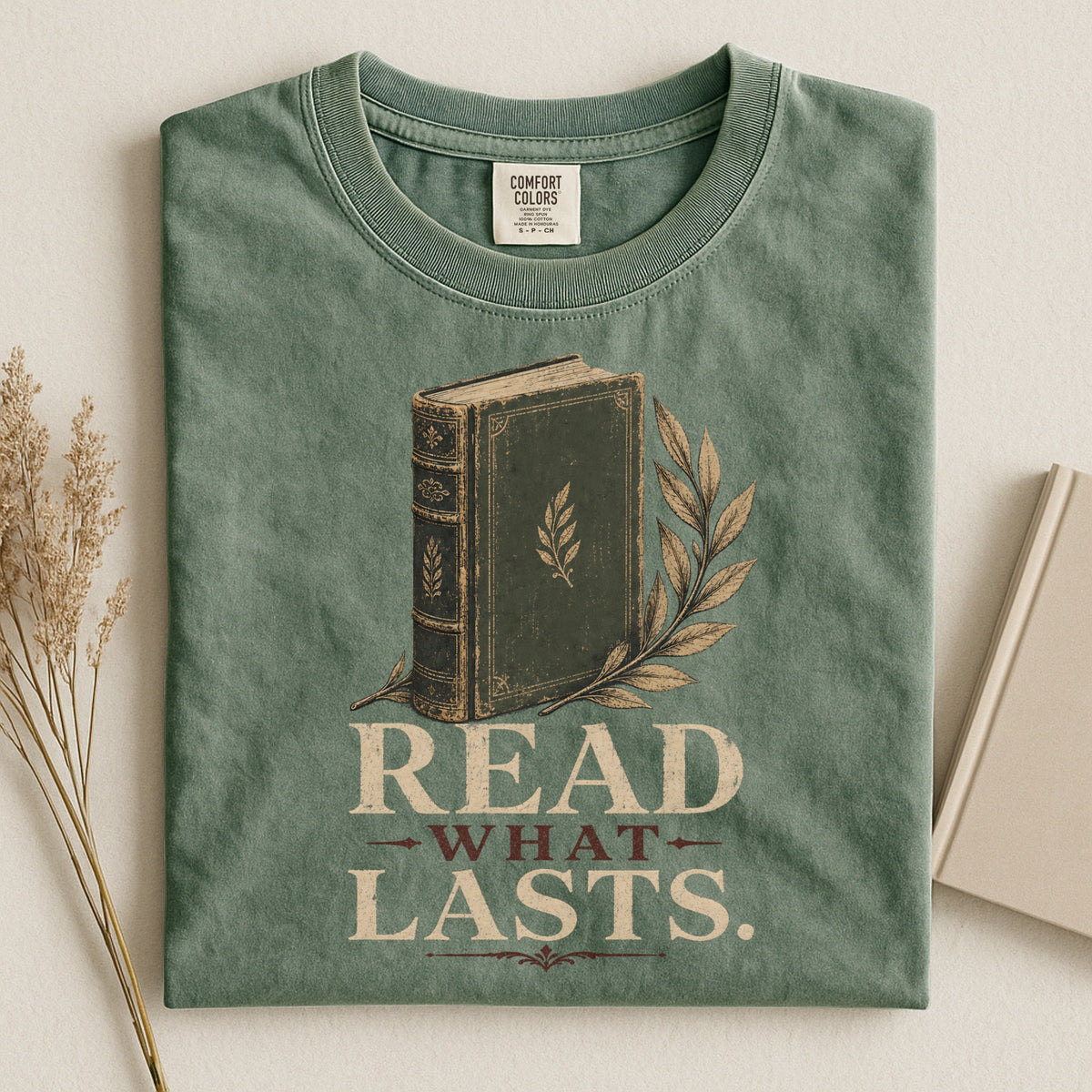 Shelf Love Studio Read What Lasts t-shirt in Moss, styled flat lay