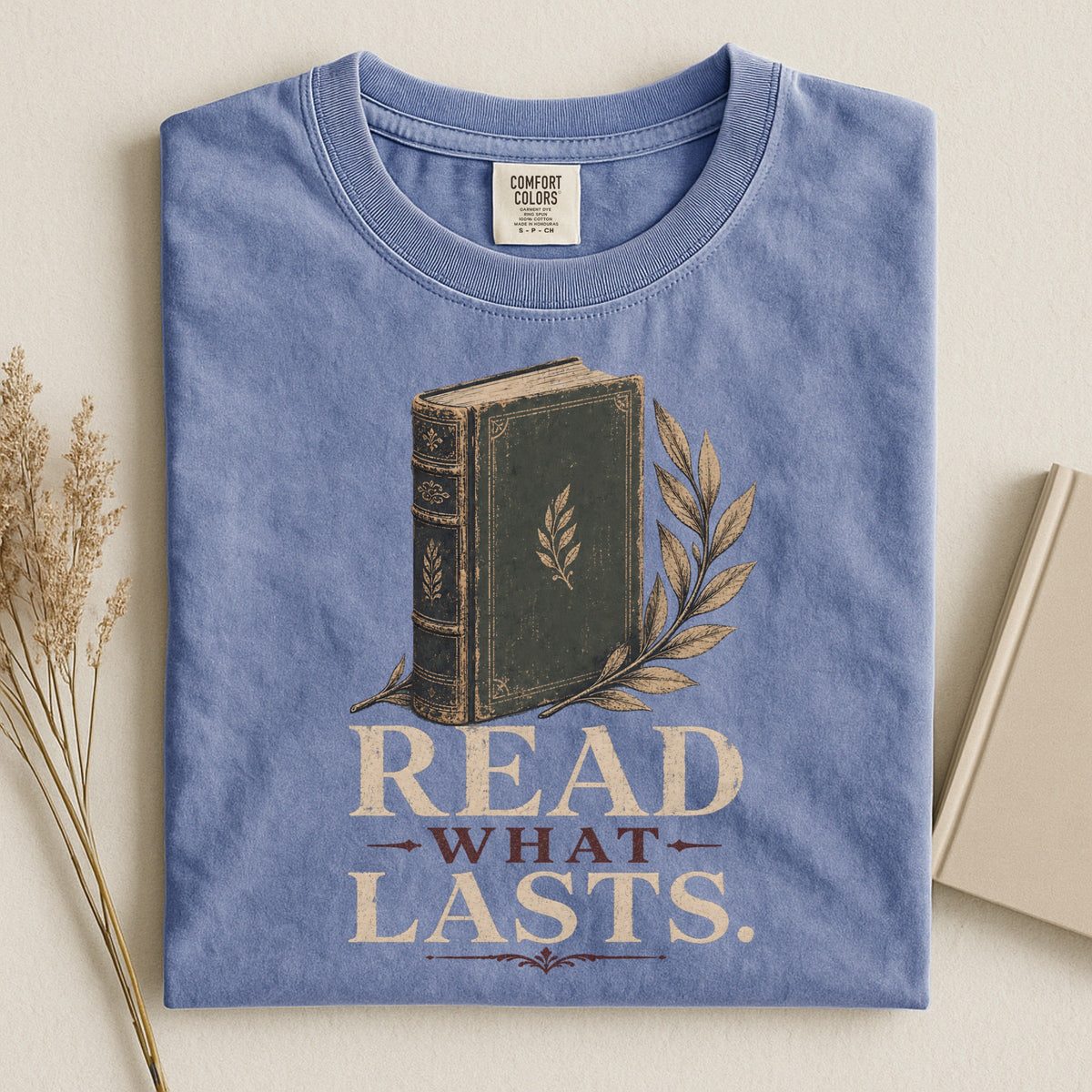 Shelf Love Studio Read What Lasts t-shirt in Blue Jean, styled flat lay