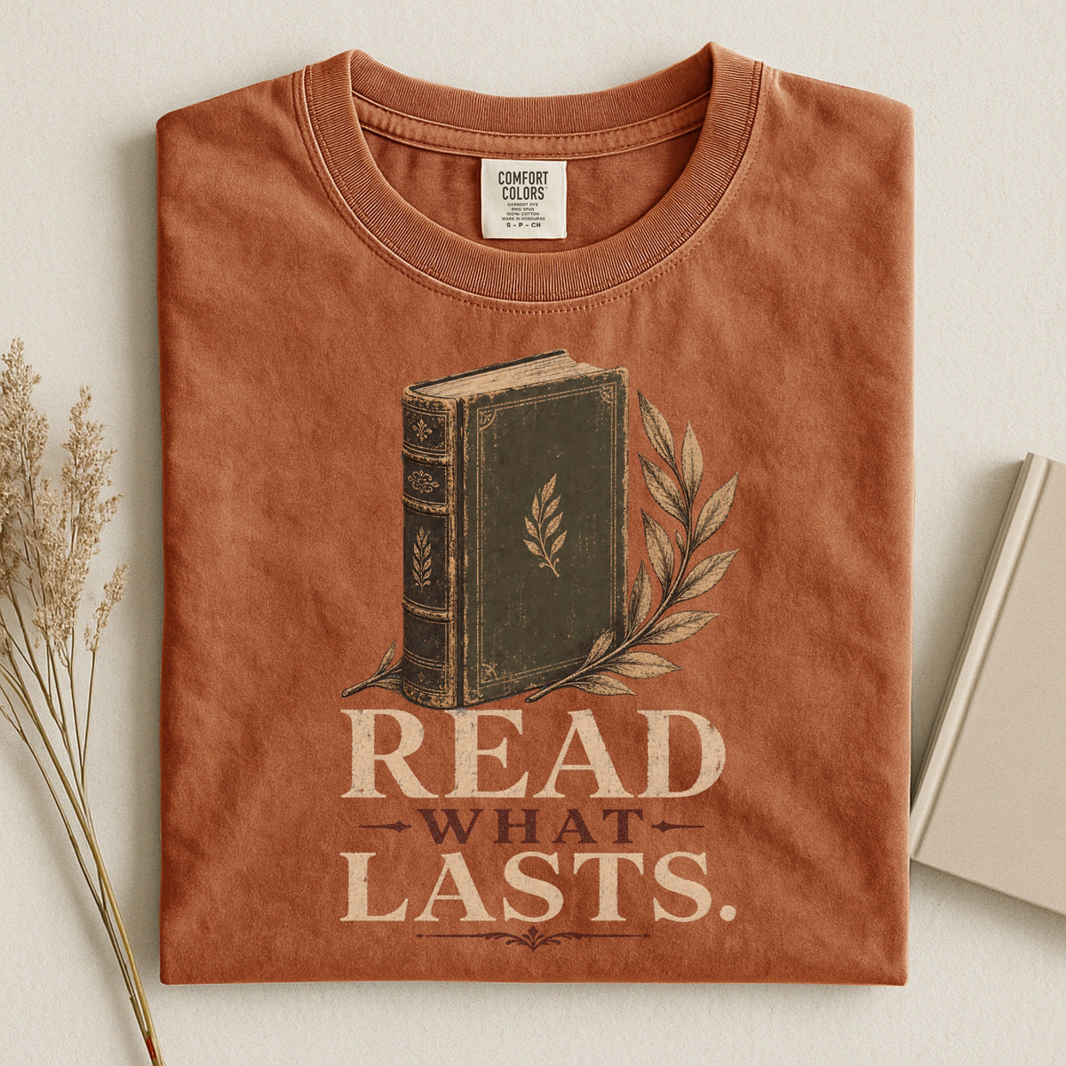 Shelf Love Studio Read What Lasts t-shirt in Yam, styled flat lay