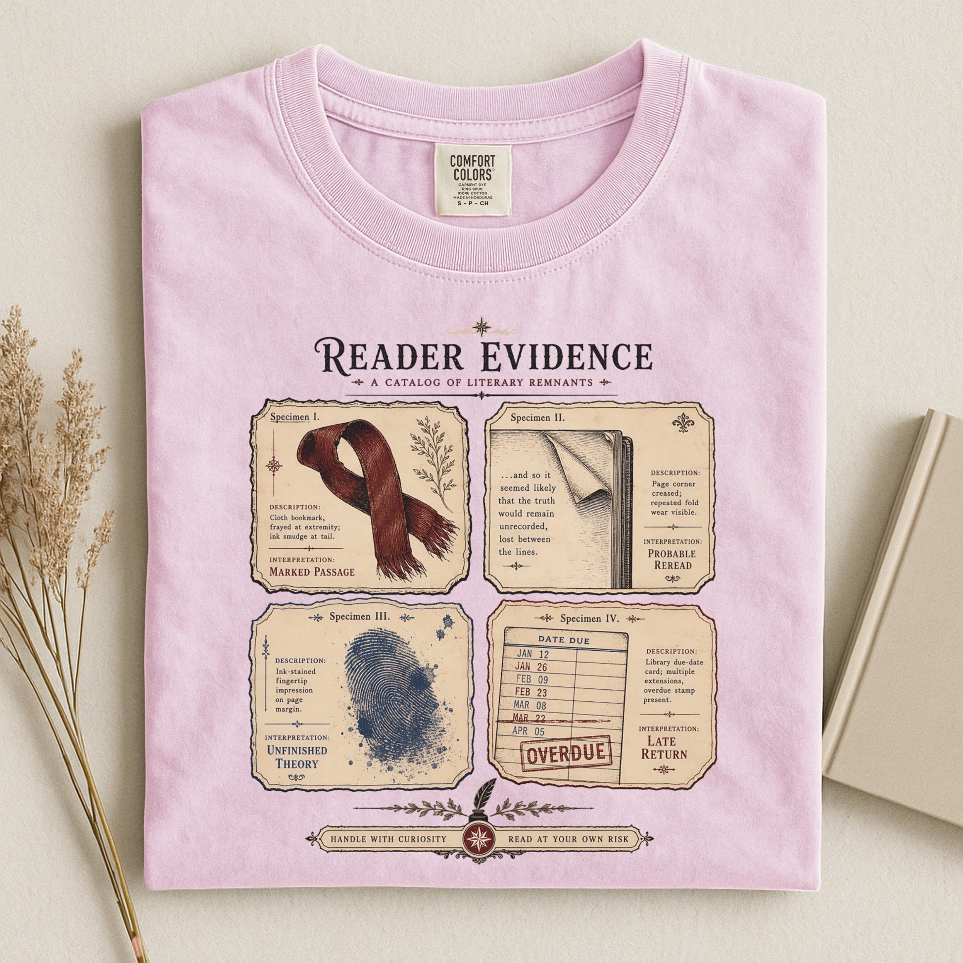 Reader Evidence bookish tee in Blossom, flat lay