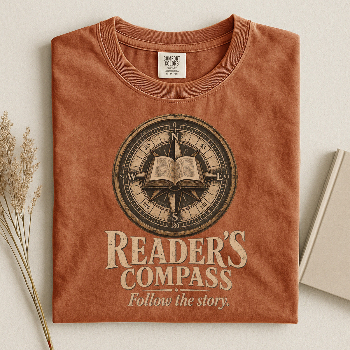 Shelf Love Studio Reader's Compass t-shirt in Yam, styled flat lay