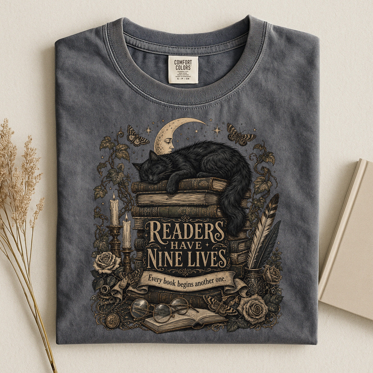 Readers Have Nine Lives bookish tee in Pepper, flat lay