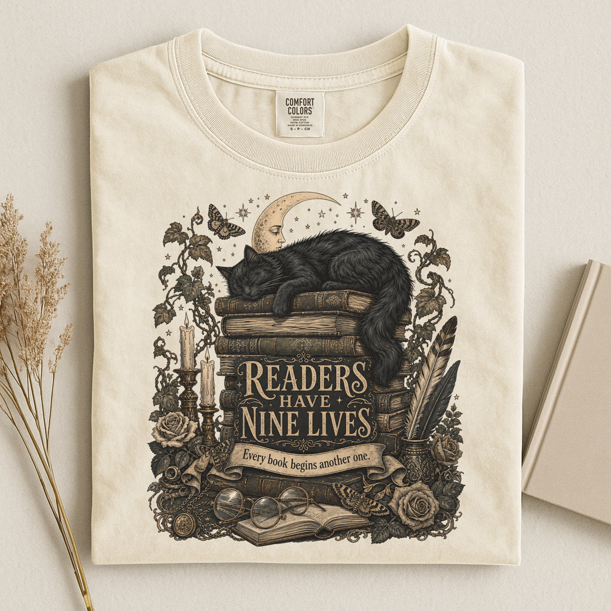 Readers Have Nine Lives bookish tee in Ivory, flat lay