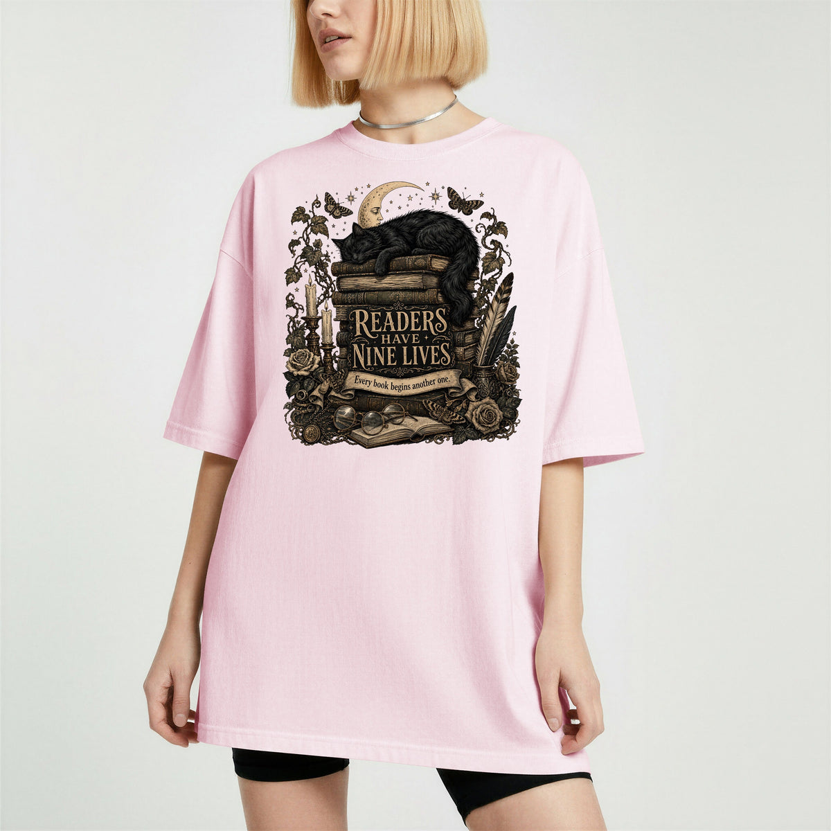 Readers Have Nine Lives bookish tee in Blossom, worn