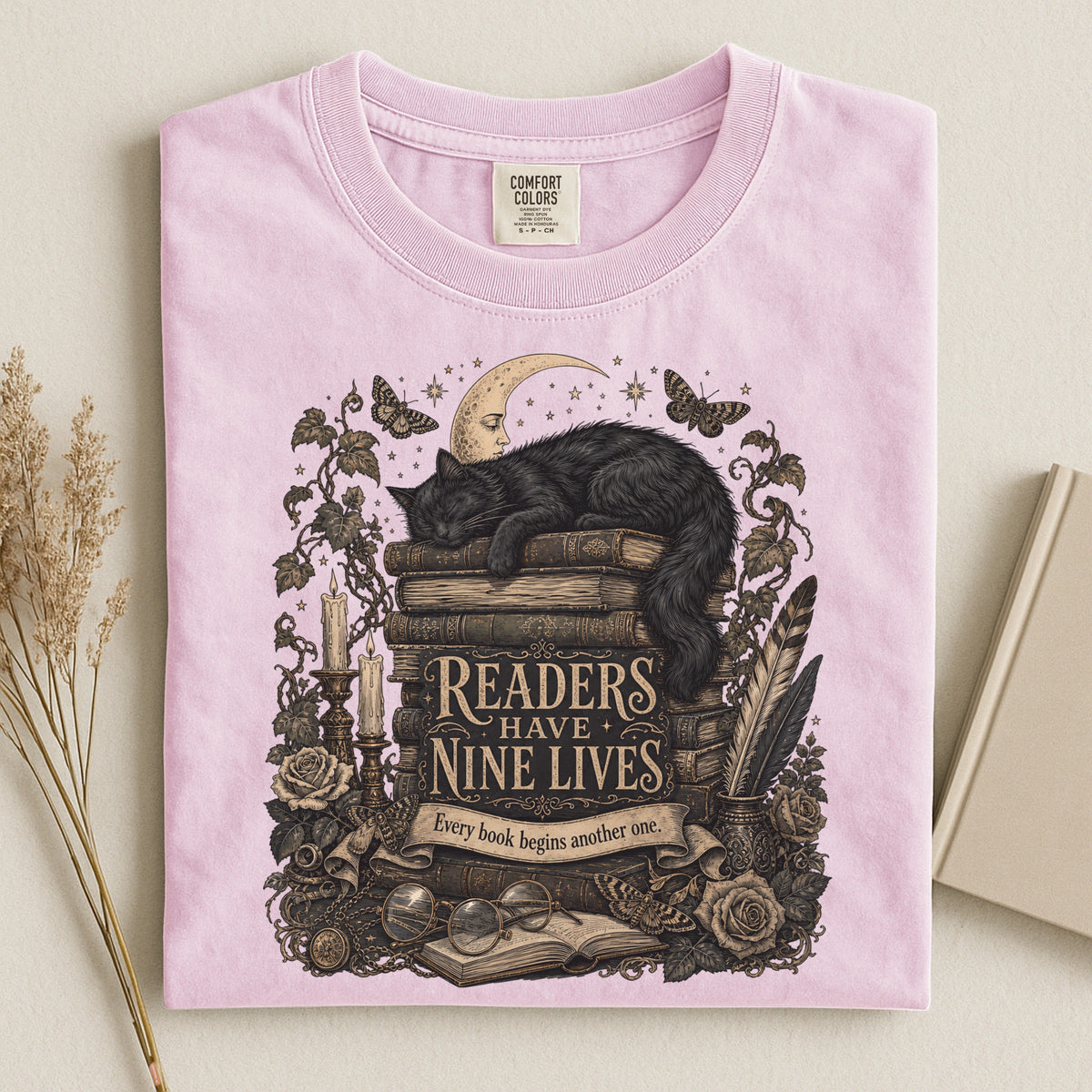 Readers Have Nine Lives bookish tee in Blossom, flat lay