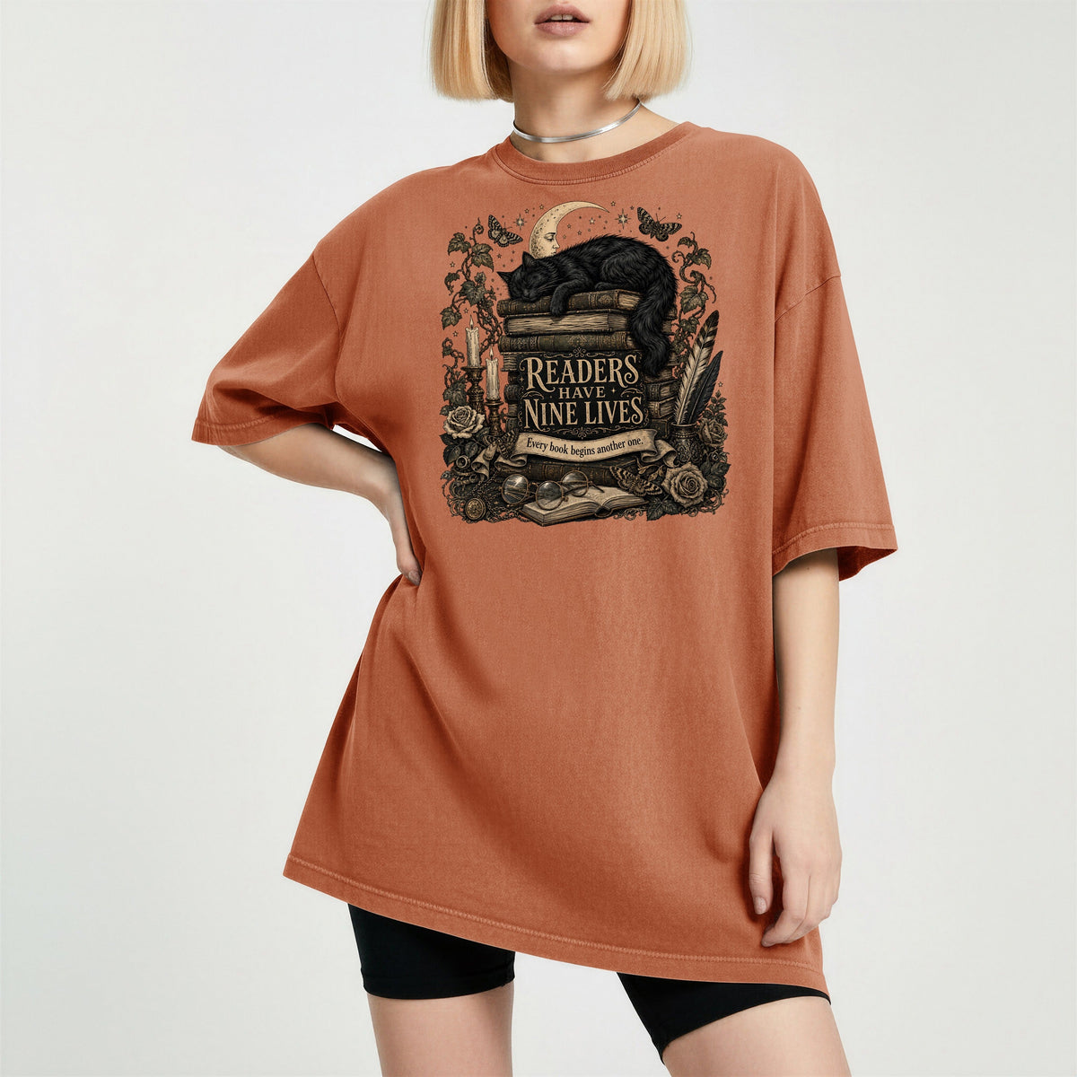 Readers Have Nine Lives bookish tee in Yam, worn