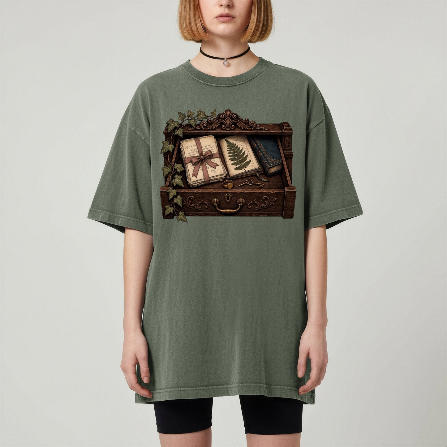 Reader's Keepsake Drawer bookish tee in Moss, worn