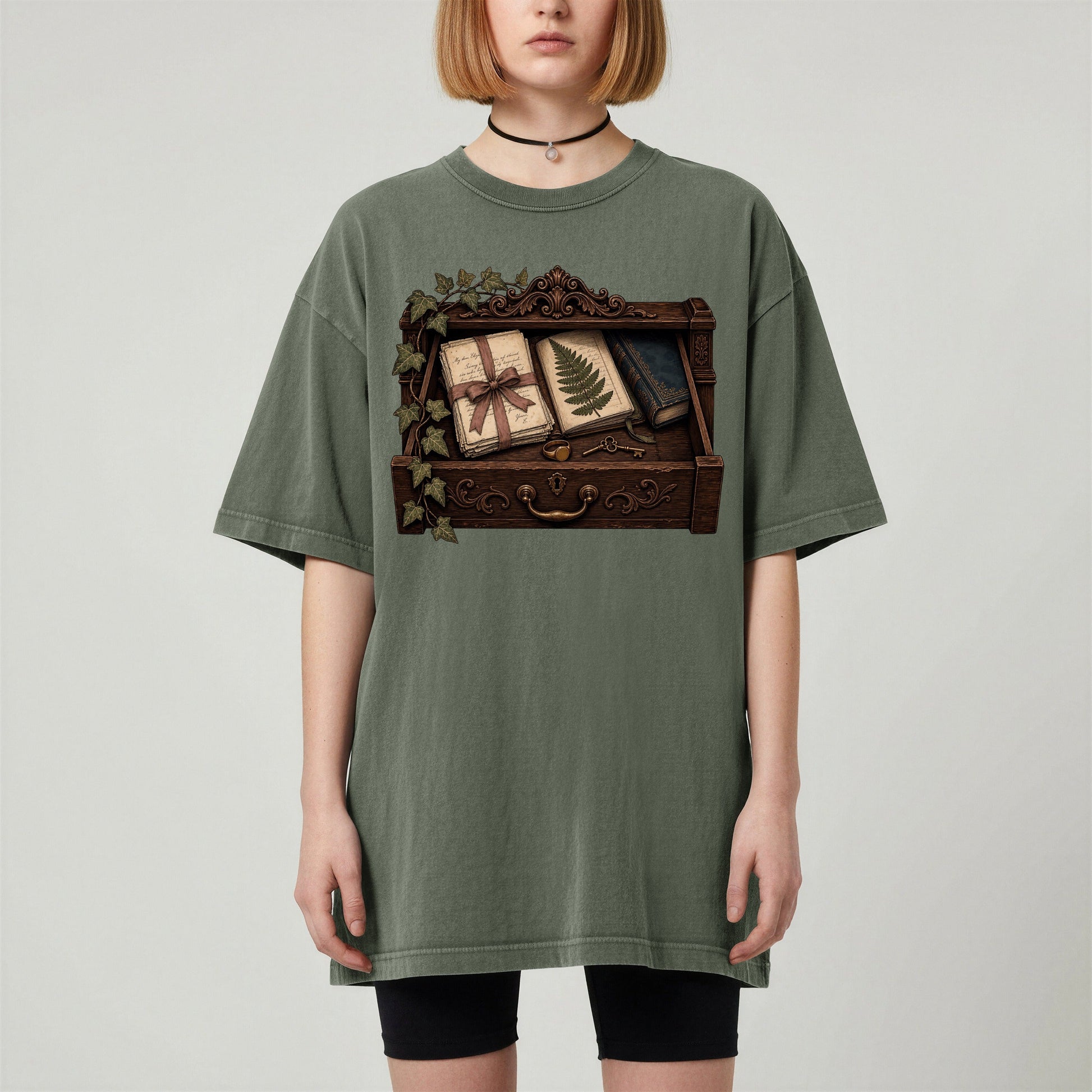Reader's Keepsake Drawer bookish tee in Moss, worn