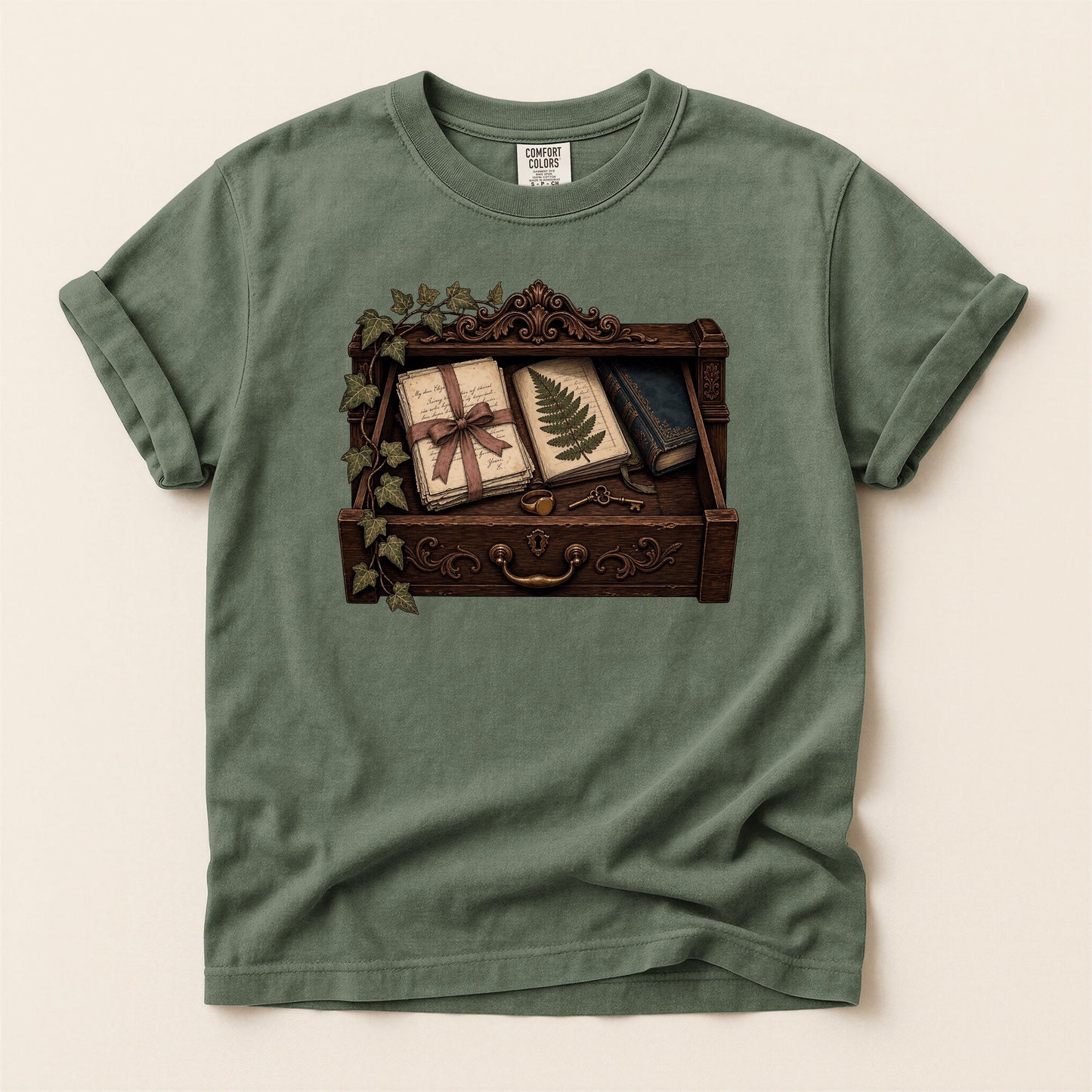 Reader's Keepsake Drawer bookish tee in Moss, full flat