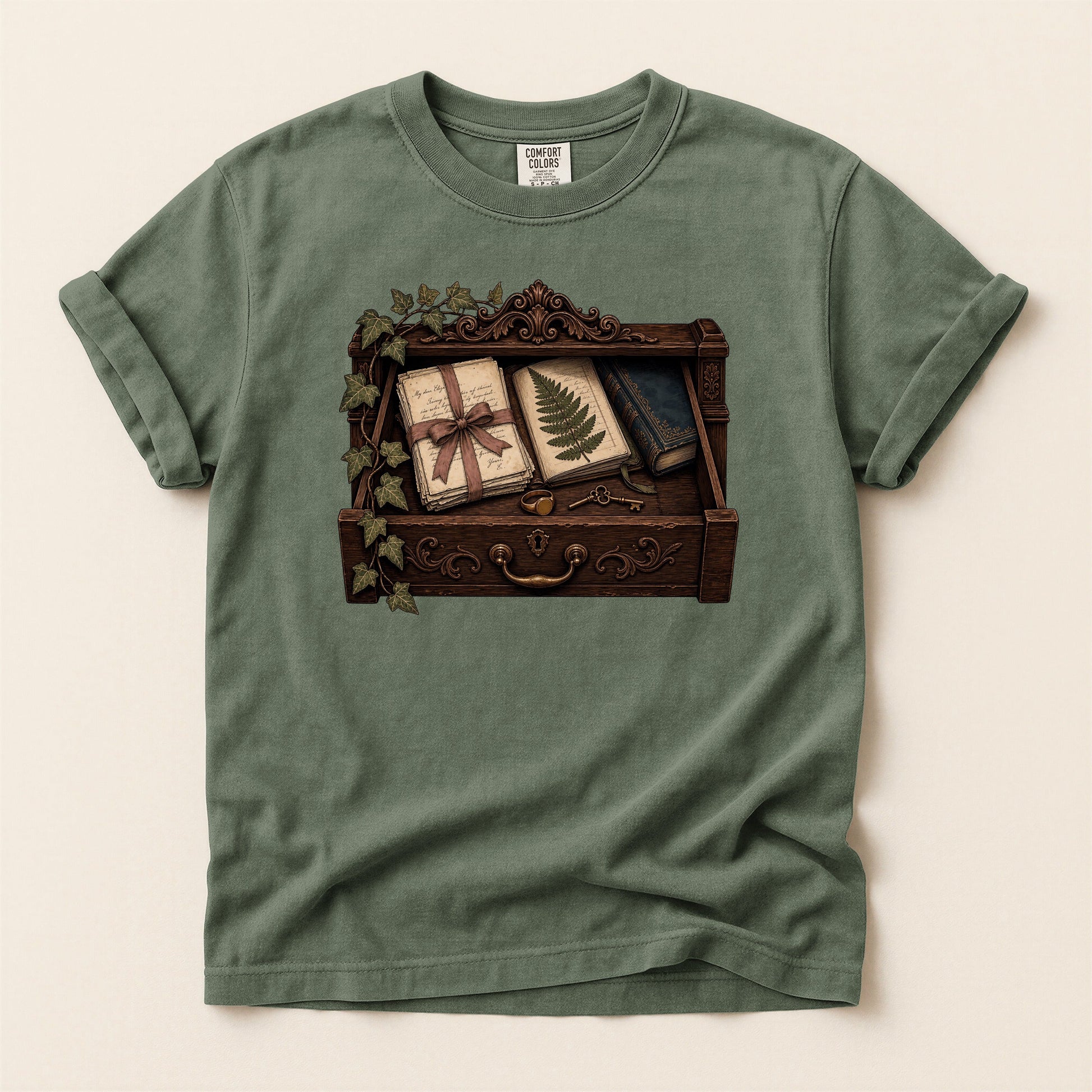 Reader's Keepsake Drawer bookish tee in Moss, full flat
