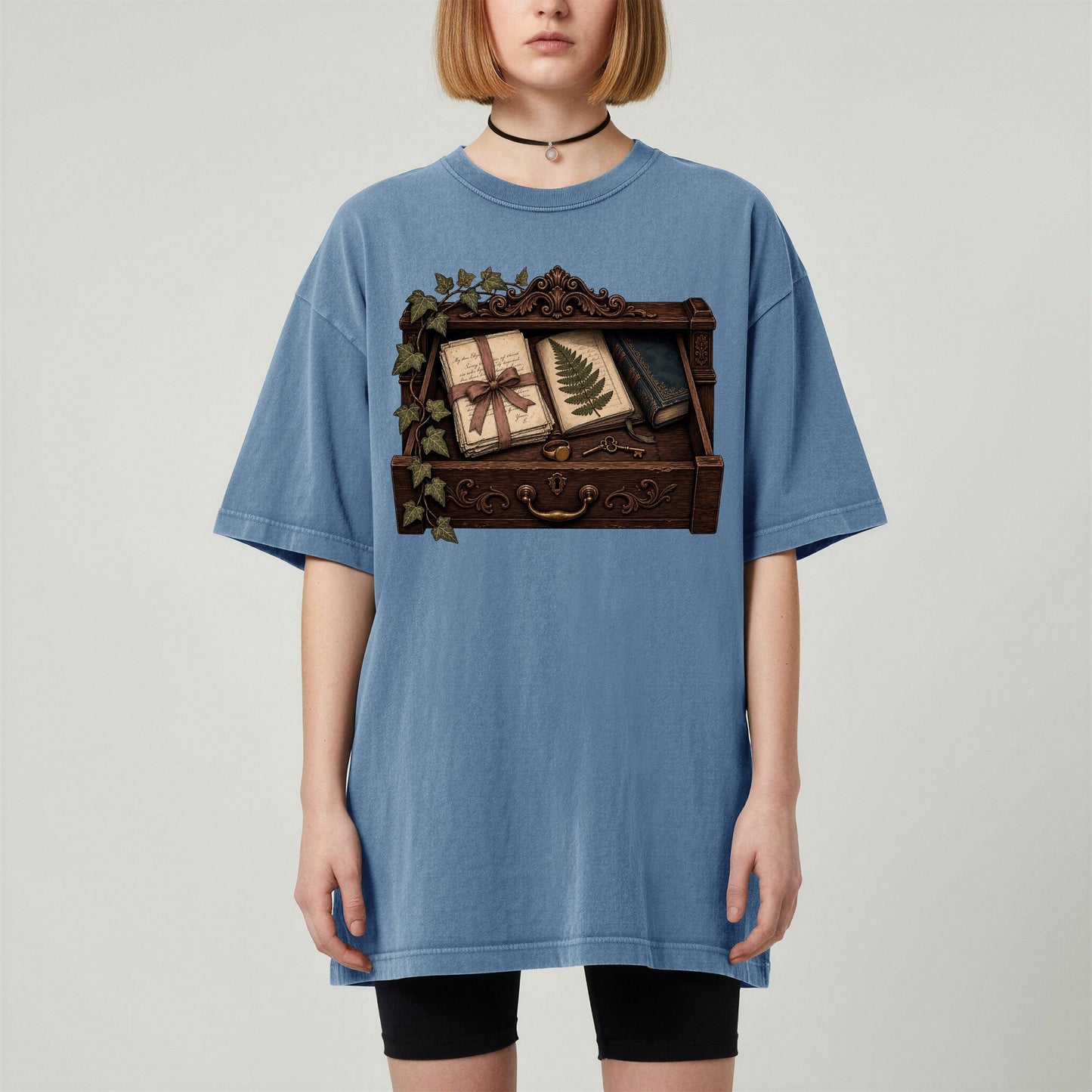 Reader's Keepsake Drawer bookish tee in Blue Jean, worn