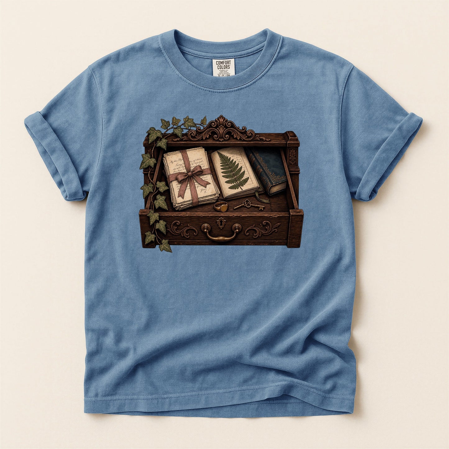 Reader's Keepsake Drawer bookish tee in Blue Jean, full flat