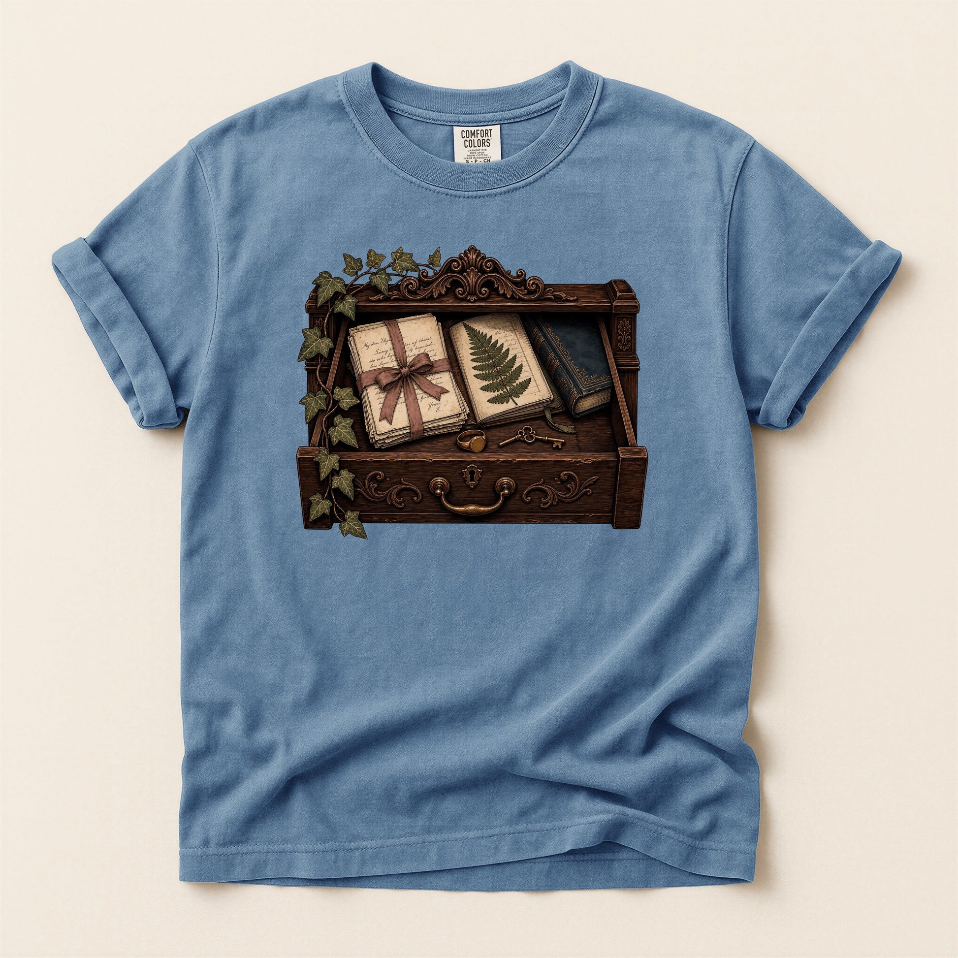 Reader's Keepsake Drawer bookish tee in Blue Jean, full flat