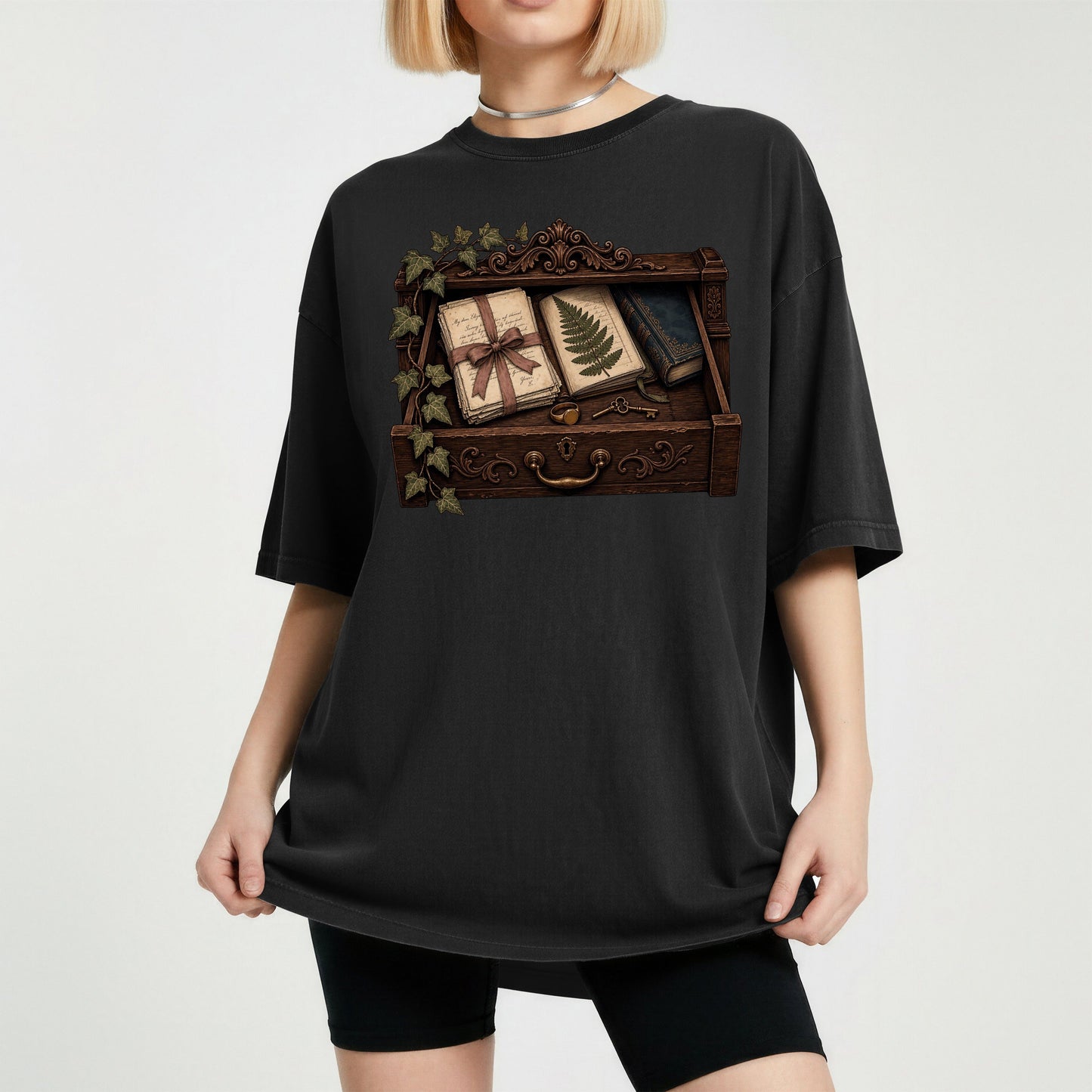 Reader's Keepsake Drawer bookish tee in Black, worn