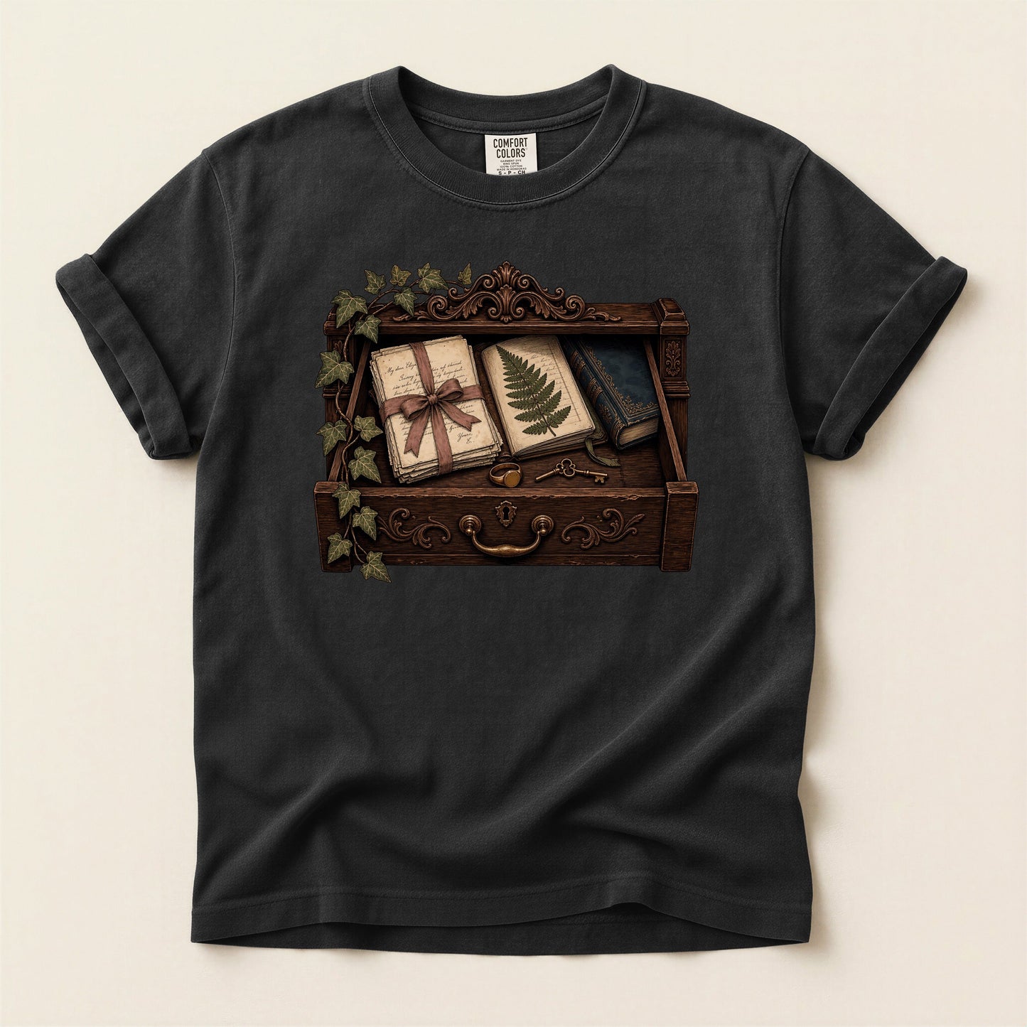 Reader's Keepsake Drawer bookish tee in Black, full flat