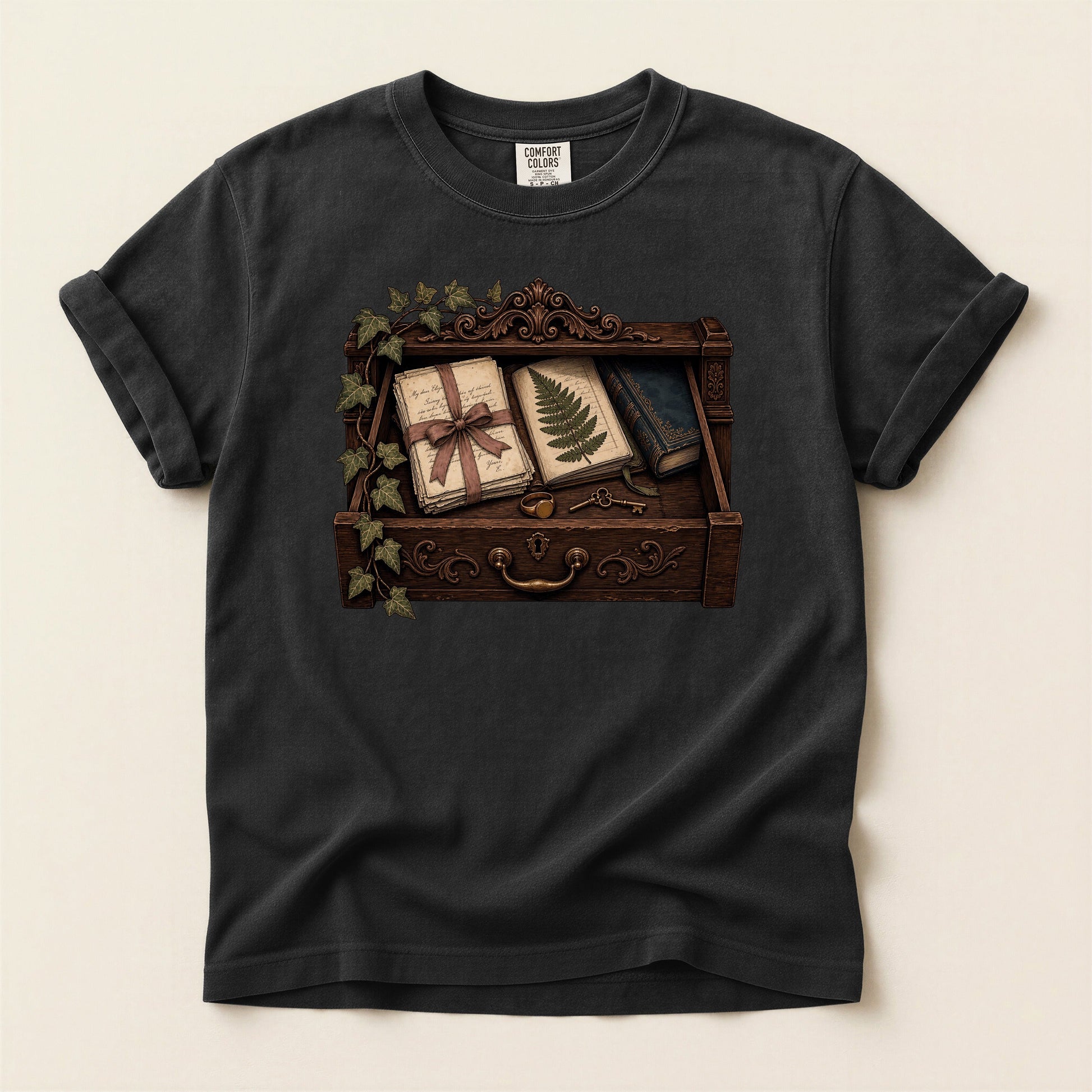 Reader's Keepsake Drawer bookish tee in Black, full flat