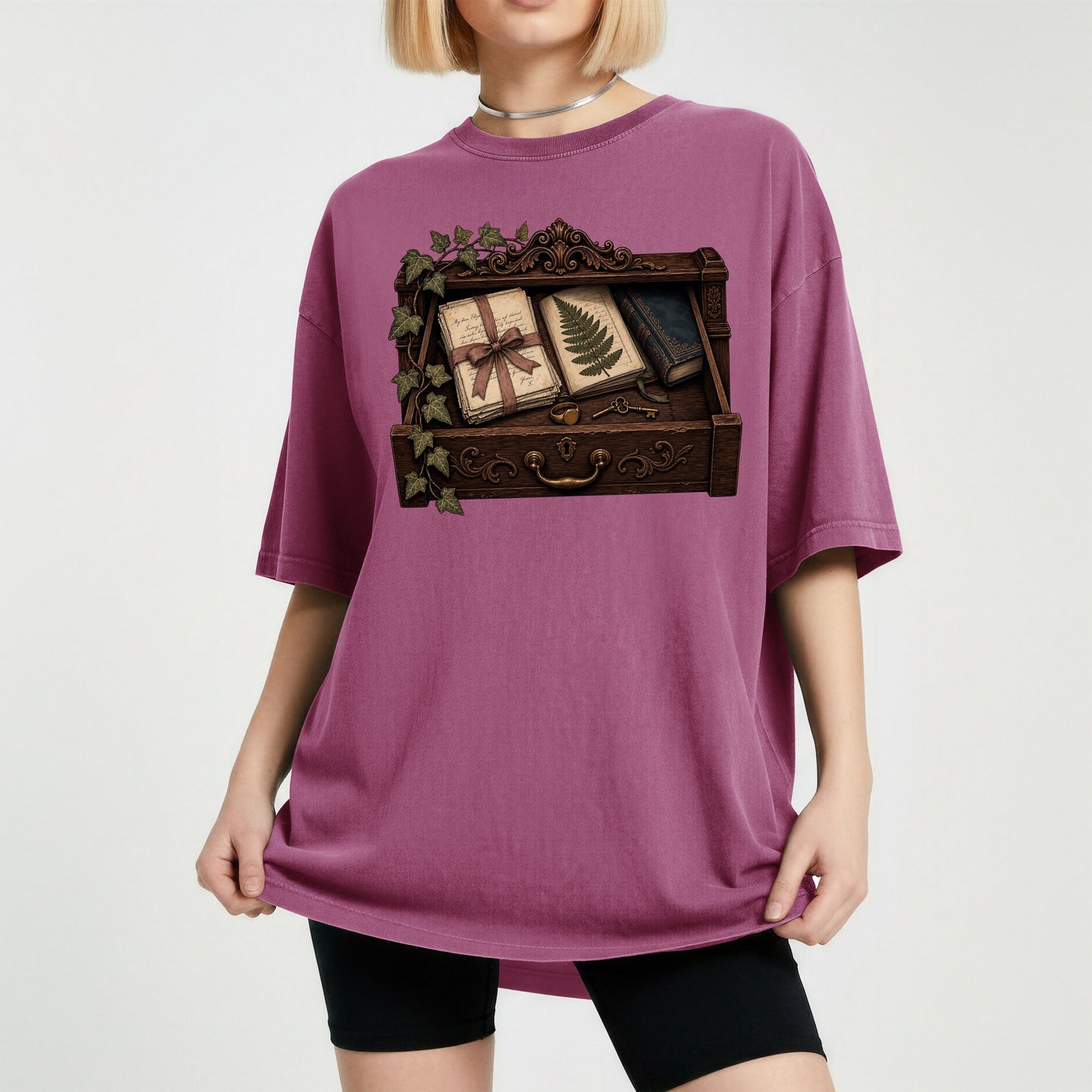 Reader's Keepsake Drawer bookish tee in Berry, worn
