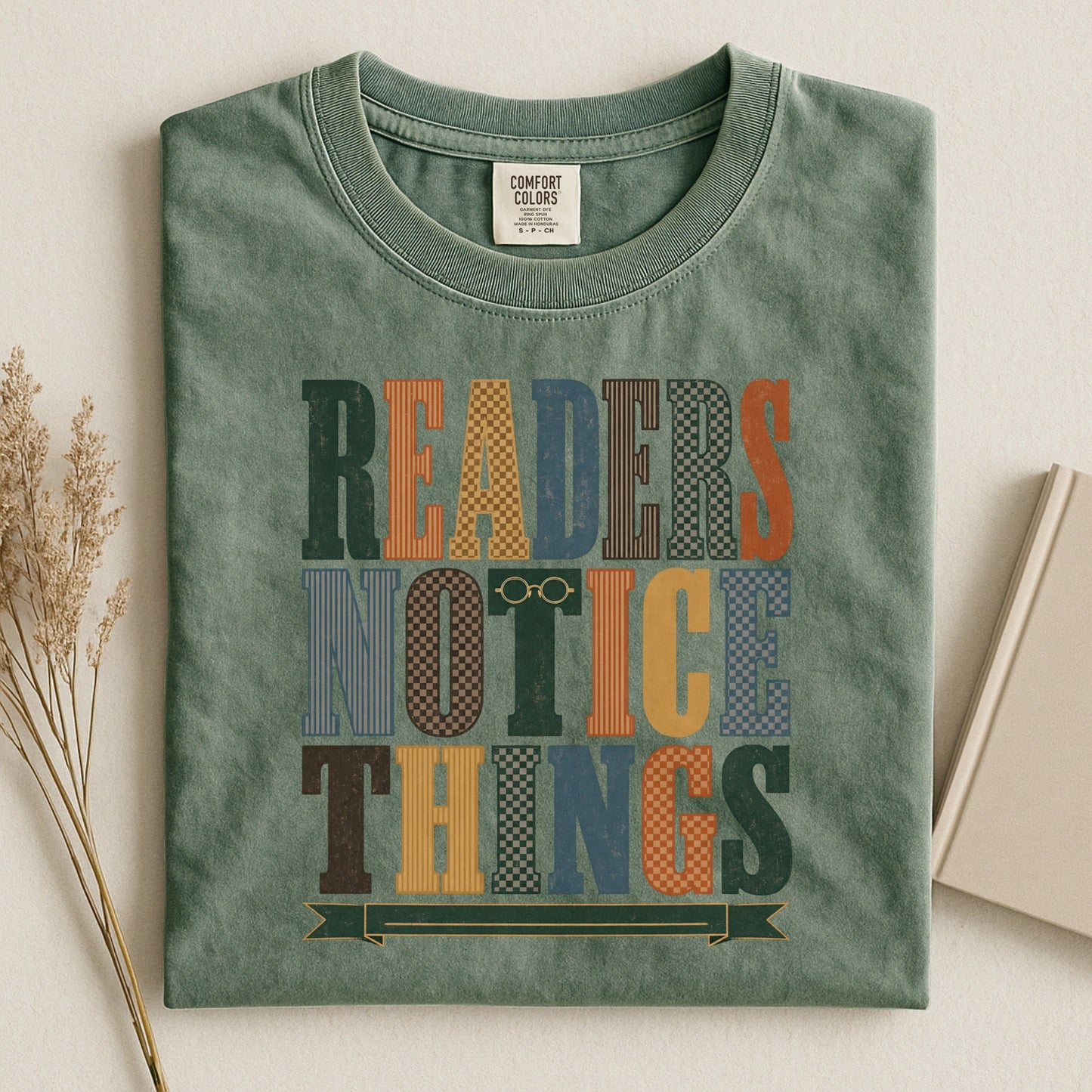 Readers Notice Things bookish tee in Moss, flat lay