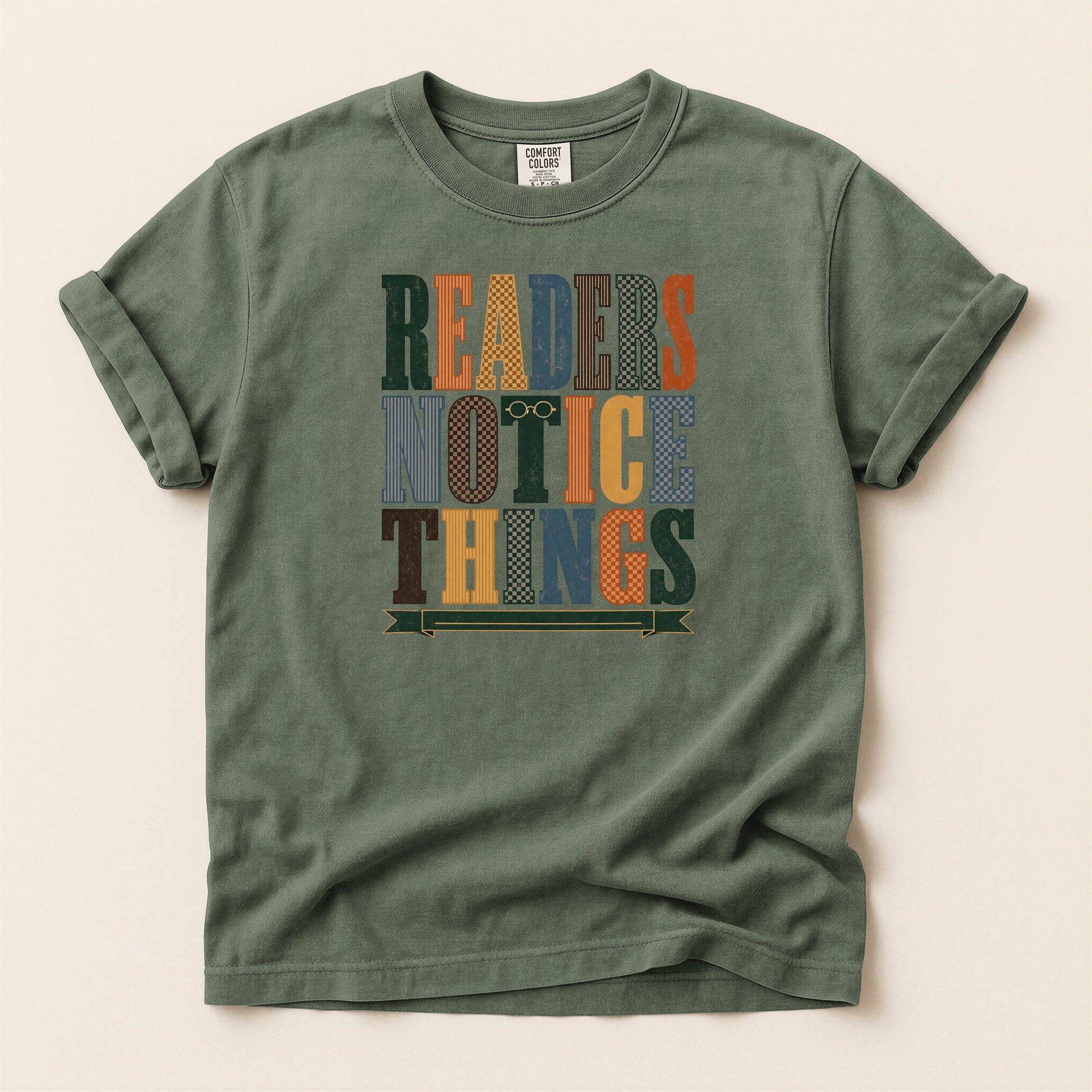 Readers Notice Things bookish tee in Moss, full flat