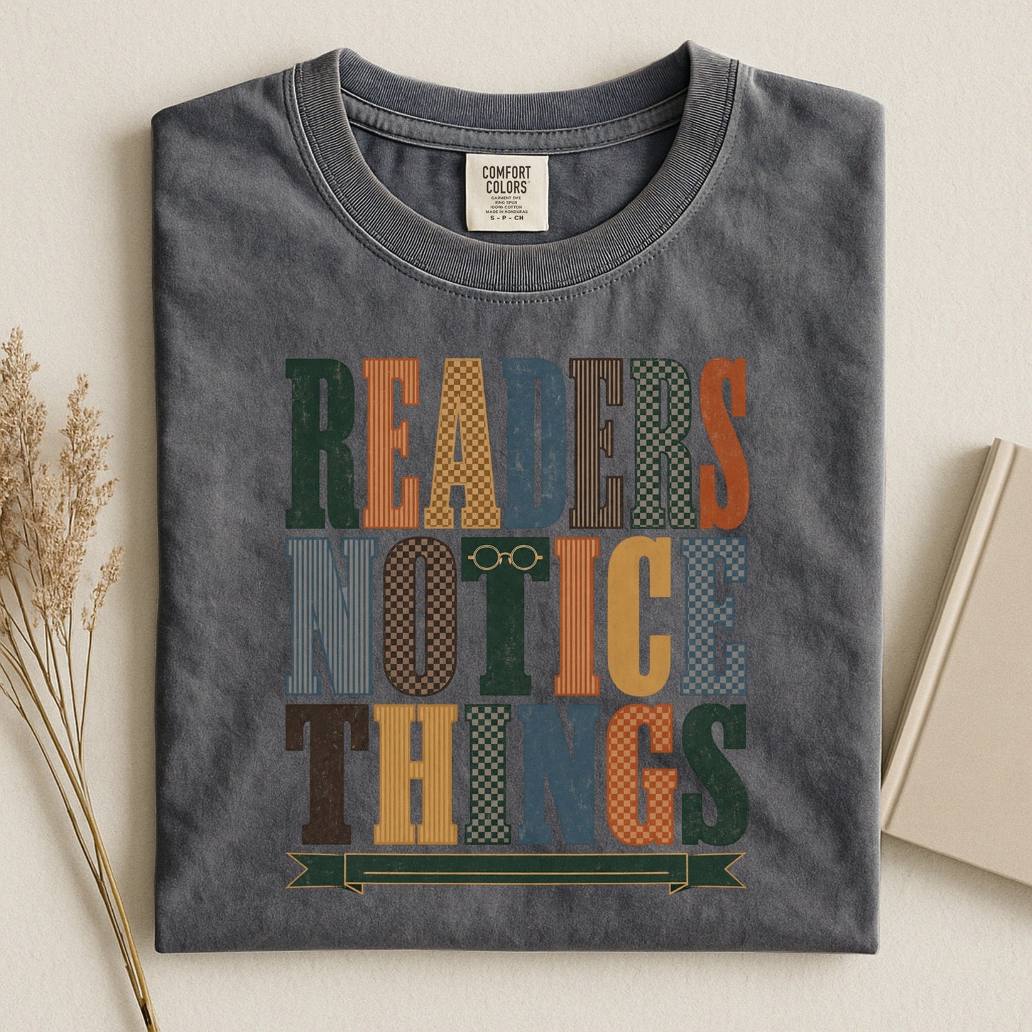 Readers Notice Things bookish tee in Pepper, flat lay