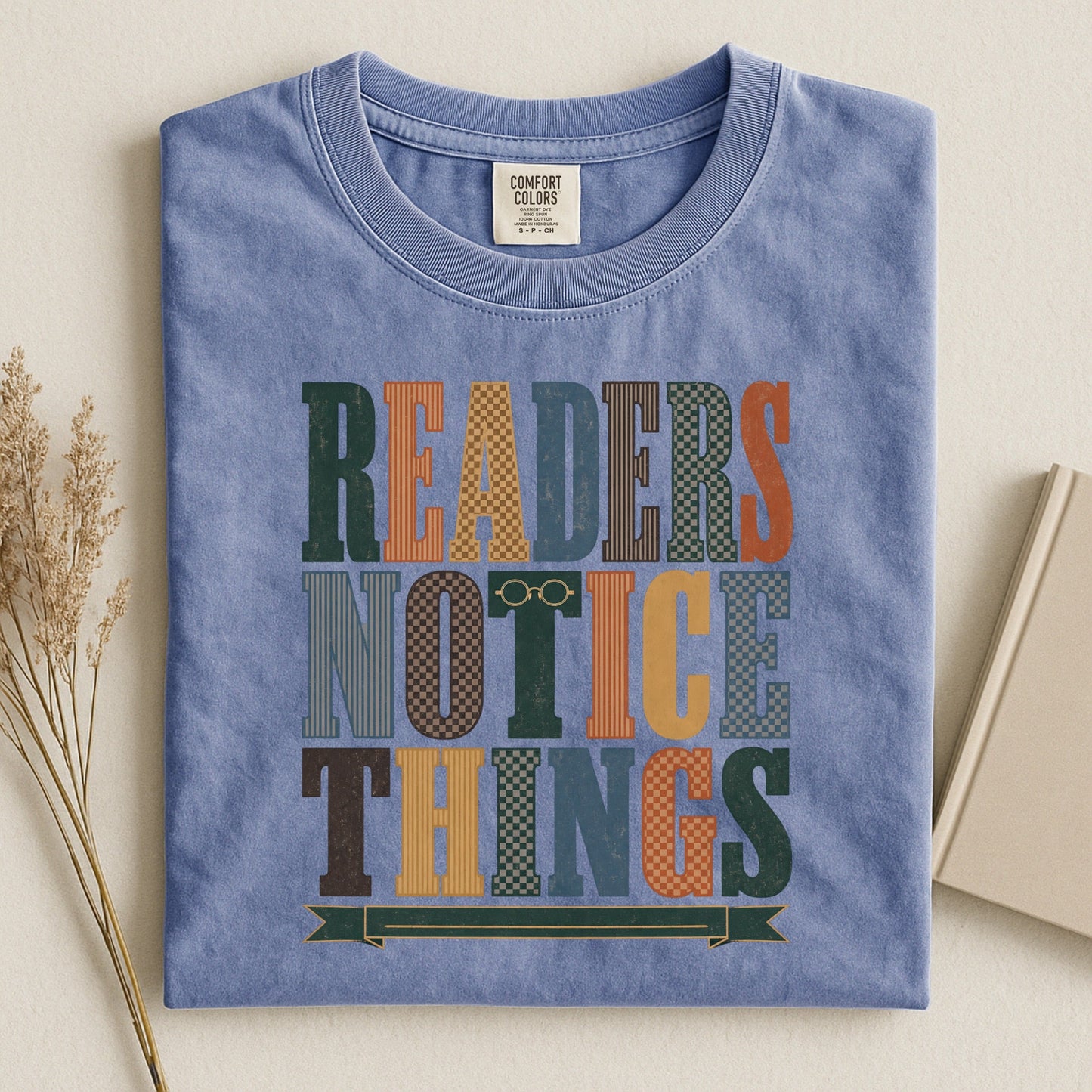 Readers Notice Things bookish tee in Blue Jean, flat lay