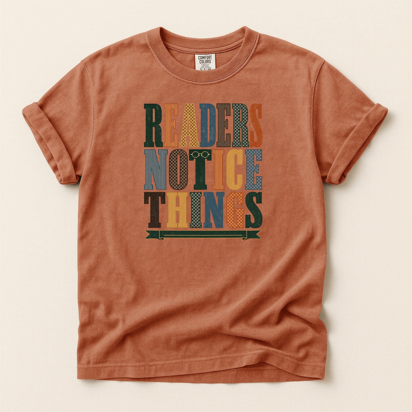 Readers Notice Things bookish tee in Yam, full flat