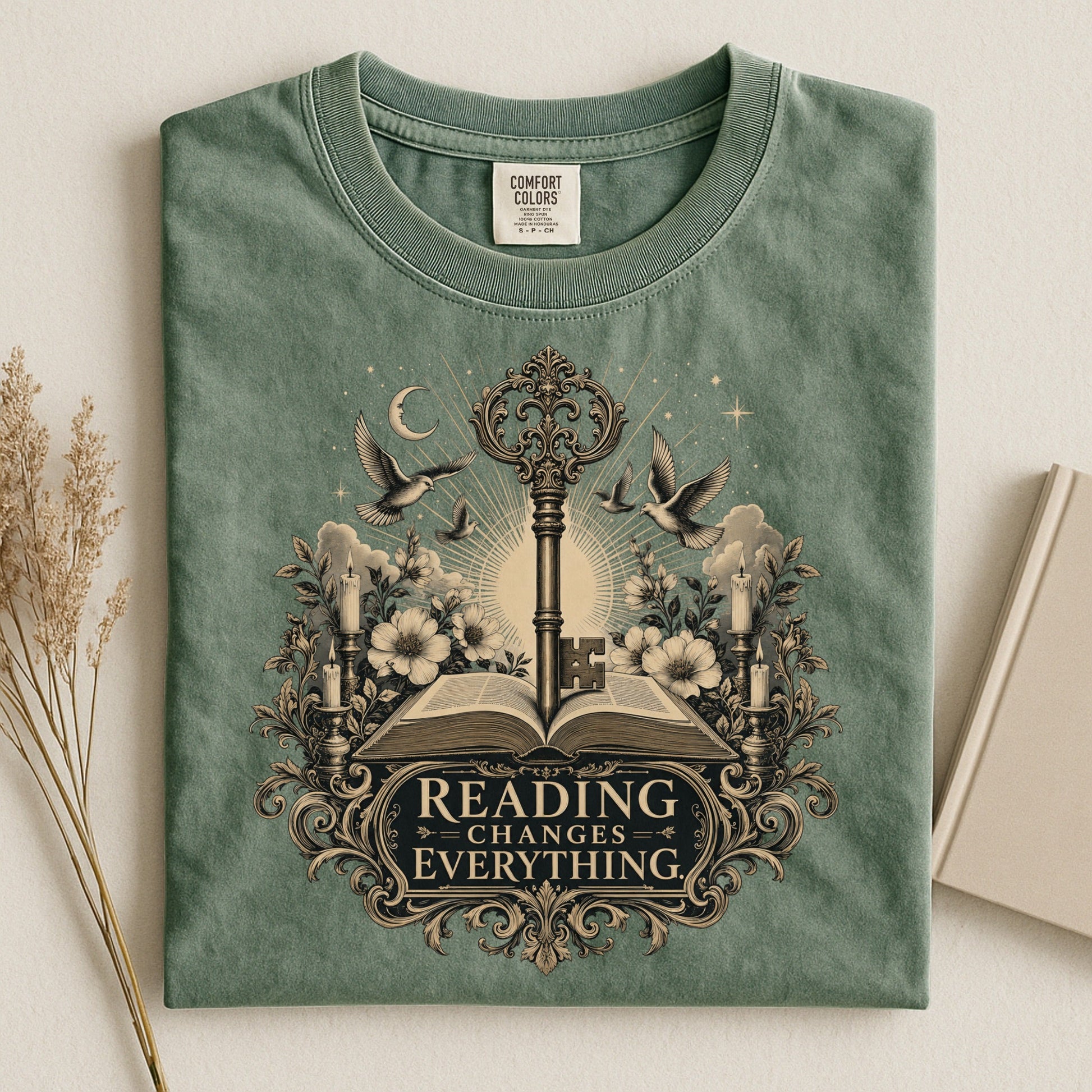 Reading Changes Everything bookish tee in Moss, flat lay