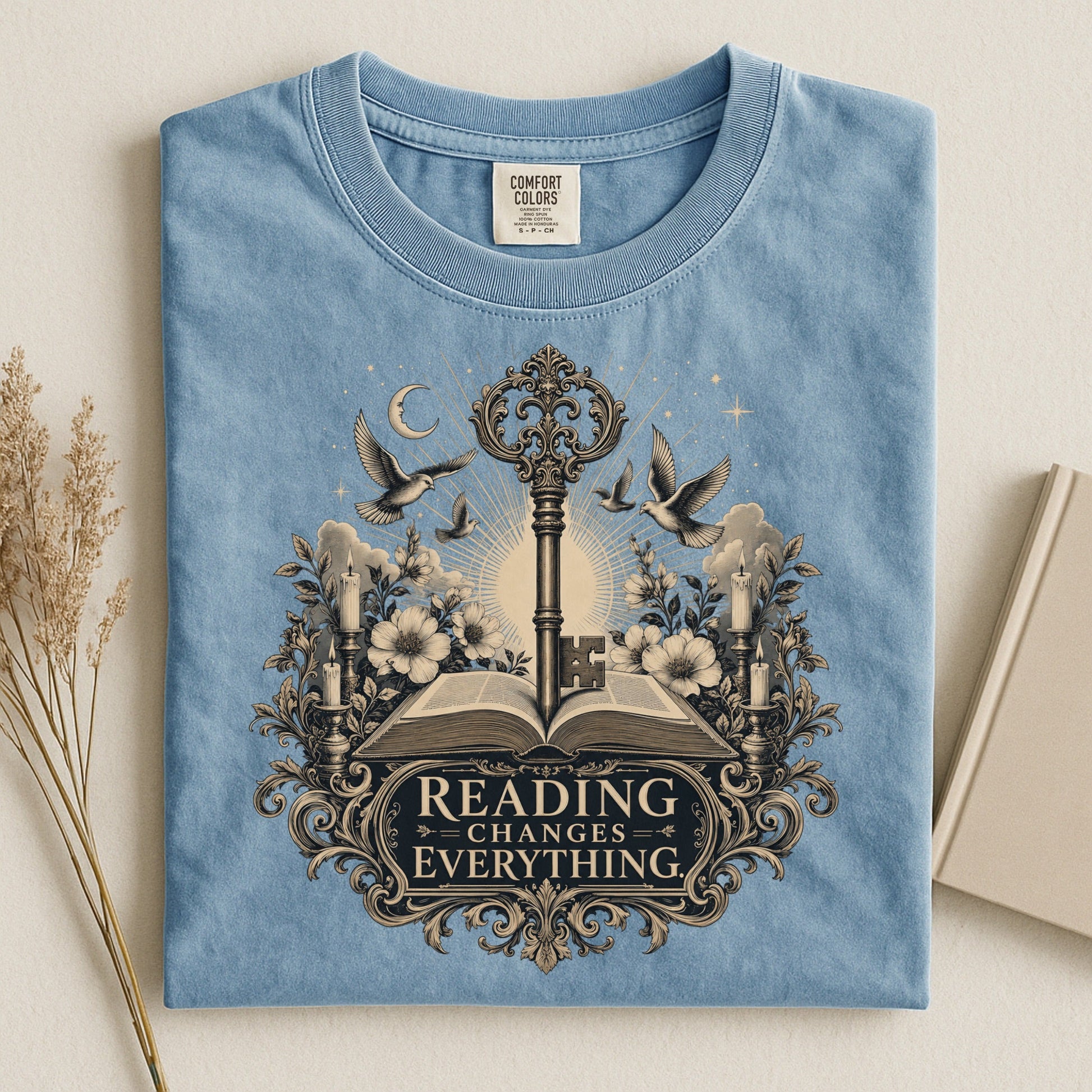 Reading Changes Everything bookish tee in Ice Blue, flat lay