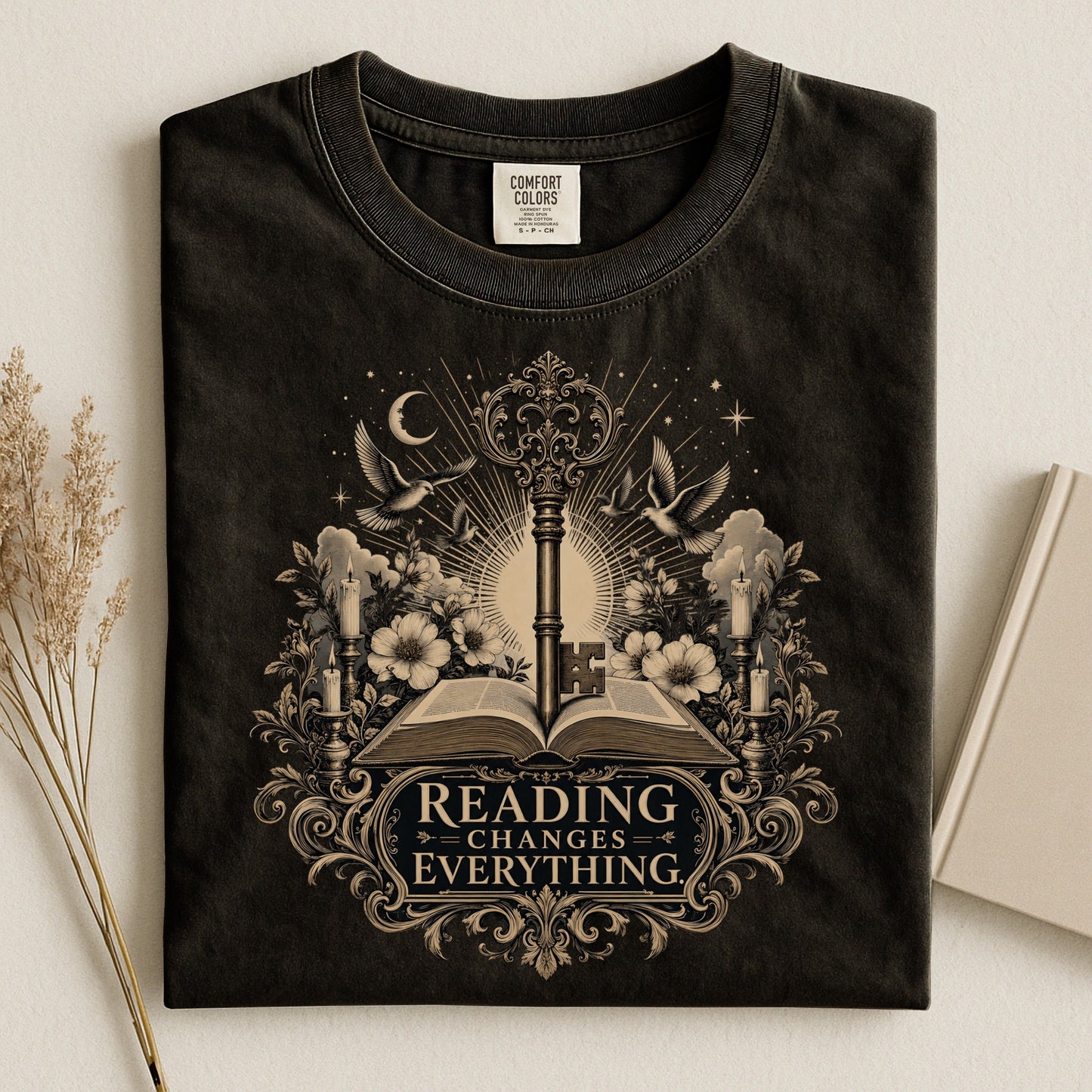 Reading Changes Everything bookish tee in Black, flat lay