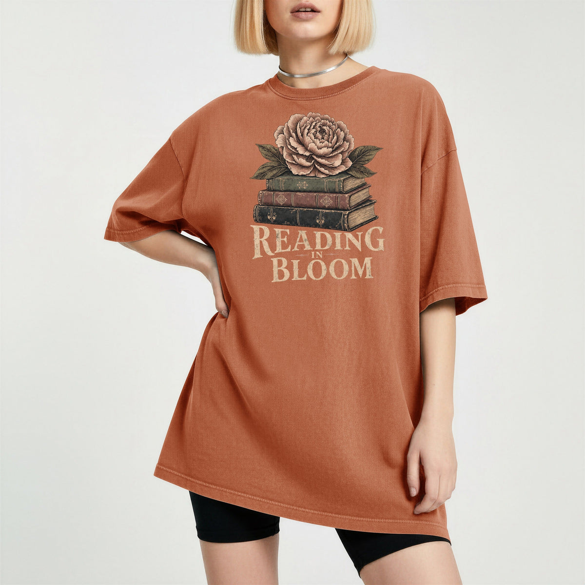 Shelf Love Studio Reading in Bloom t-shirt in Yam, worn