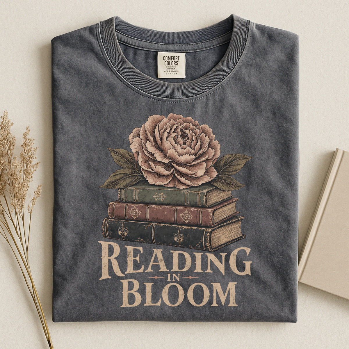 Shelf Love Studio Reading in Bloom t-shirt in Pepper, styled flat lay