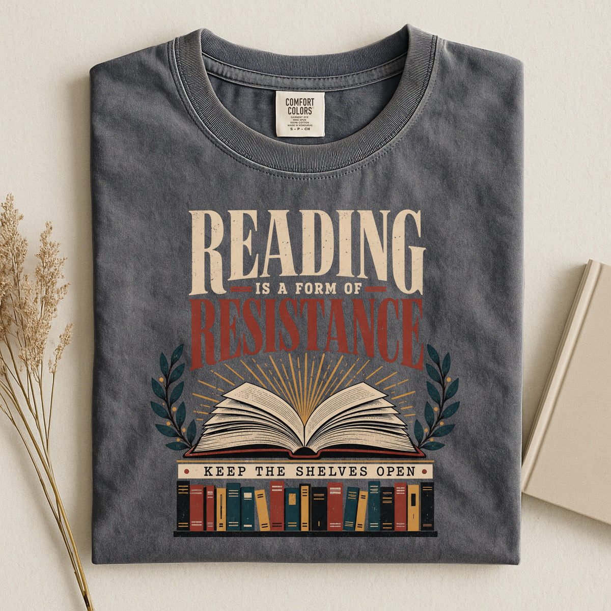 Shelf Love Studio Reading Is a Form of Resistance t-shirt in Pepper, styled flat lay