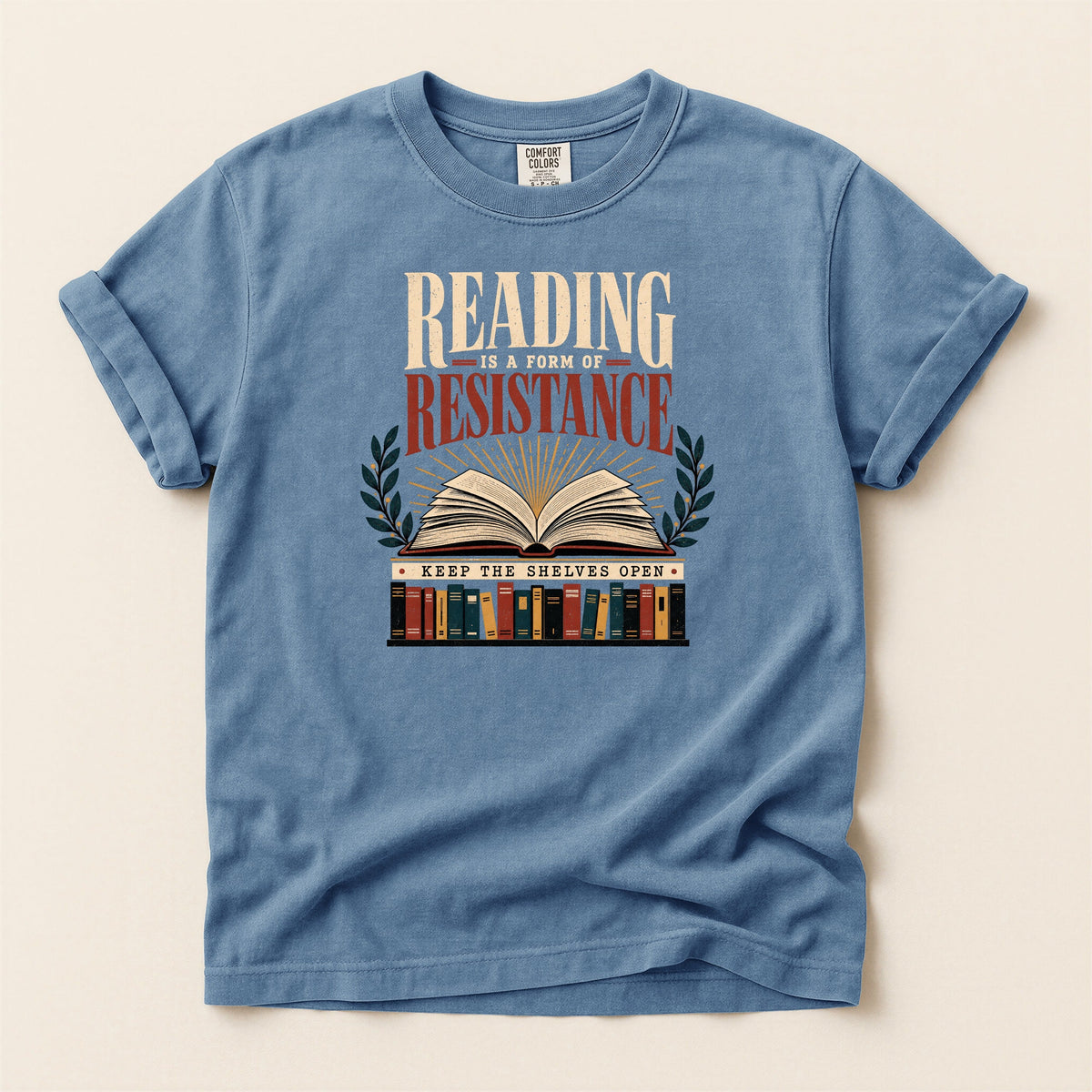 Shelf Love Studio Reading Is a Form of Resistance t-shirt in Blue Jean, flat