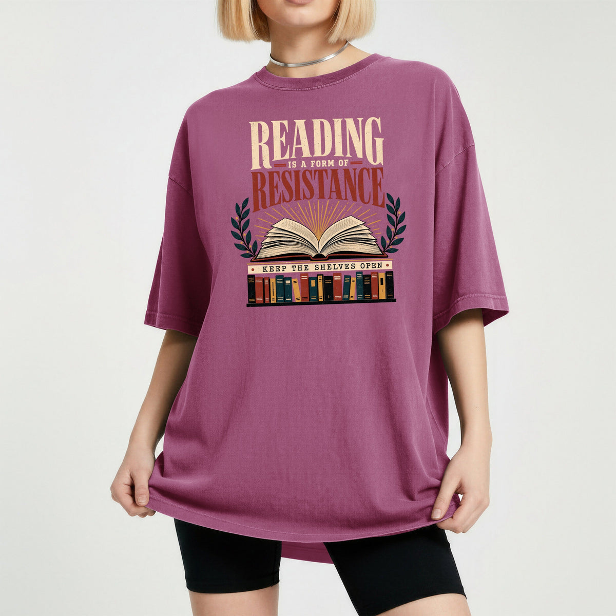 Shelf Love Studio Reading Is a Form of Resistance t-shirt in Berry, worn