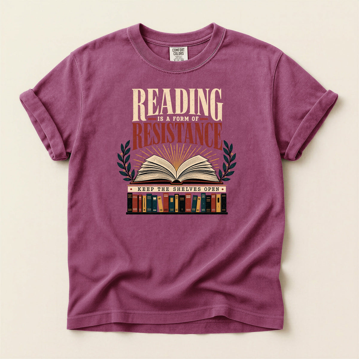 Shelf Love Studio Reading Is a Form of Resistance t-shirt in Berry, flat