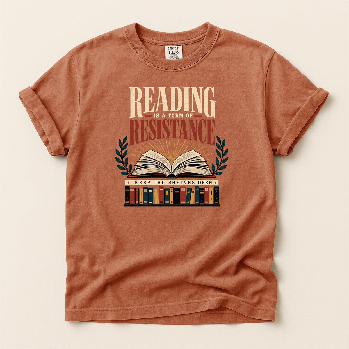 Shelf Love Studio Reading Is a Form of Resistance t-shirt in Yam, flat