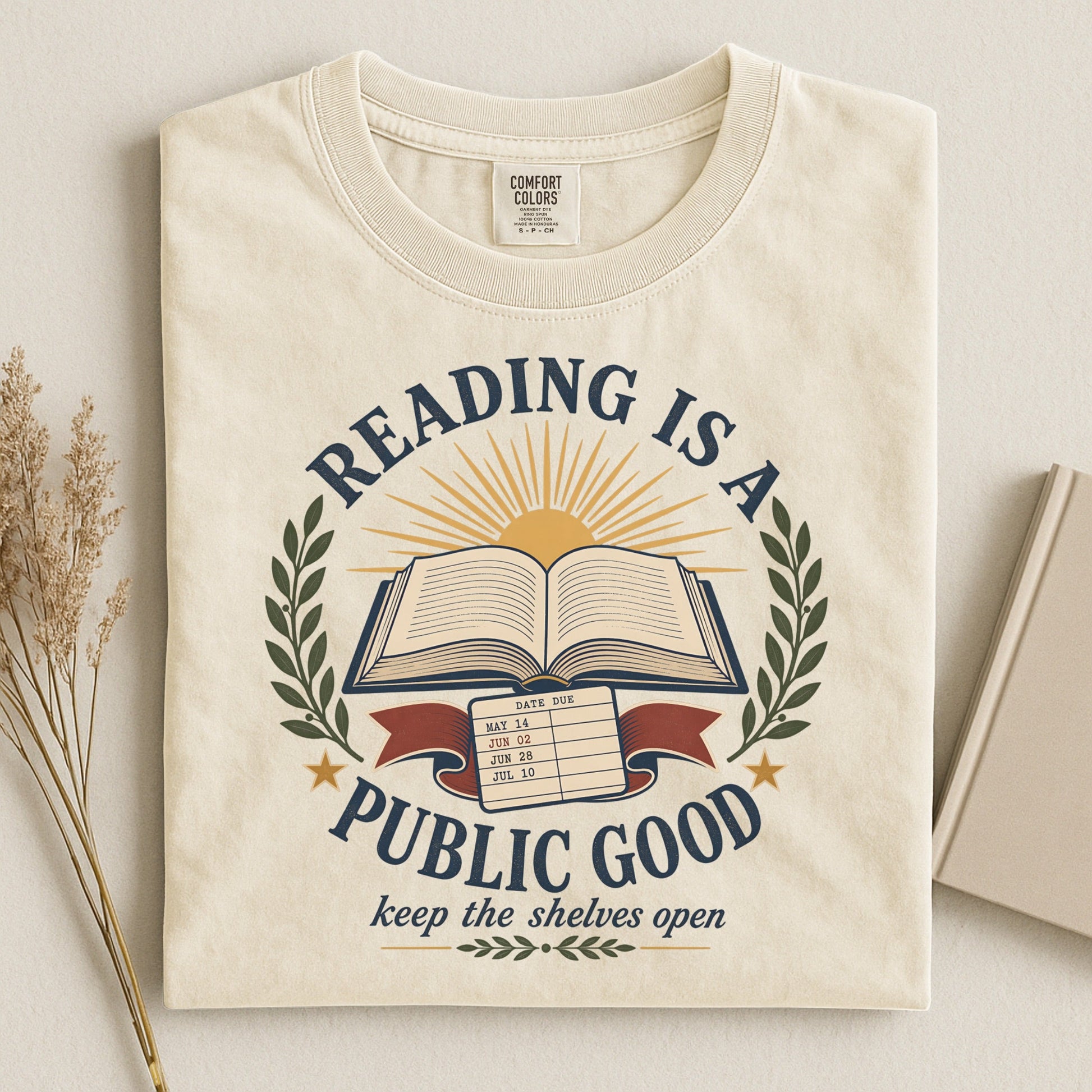 Reading Is a Public Good bookish tee in Ivory, flat lay