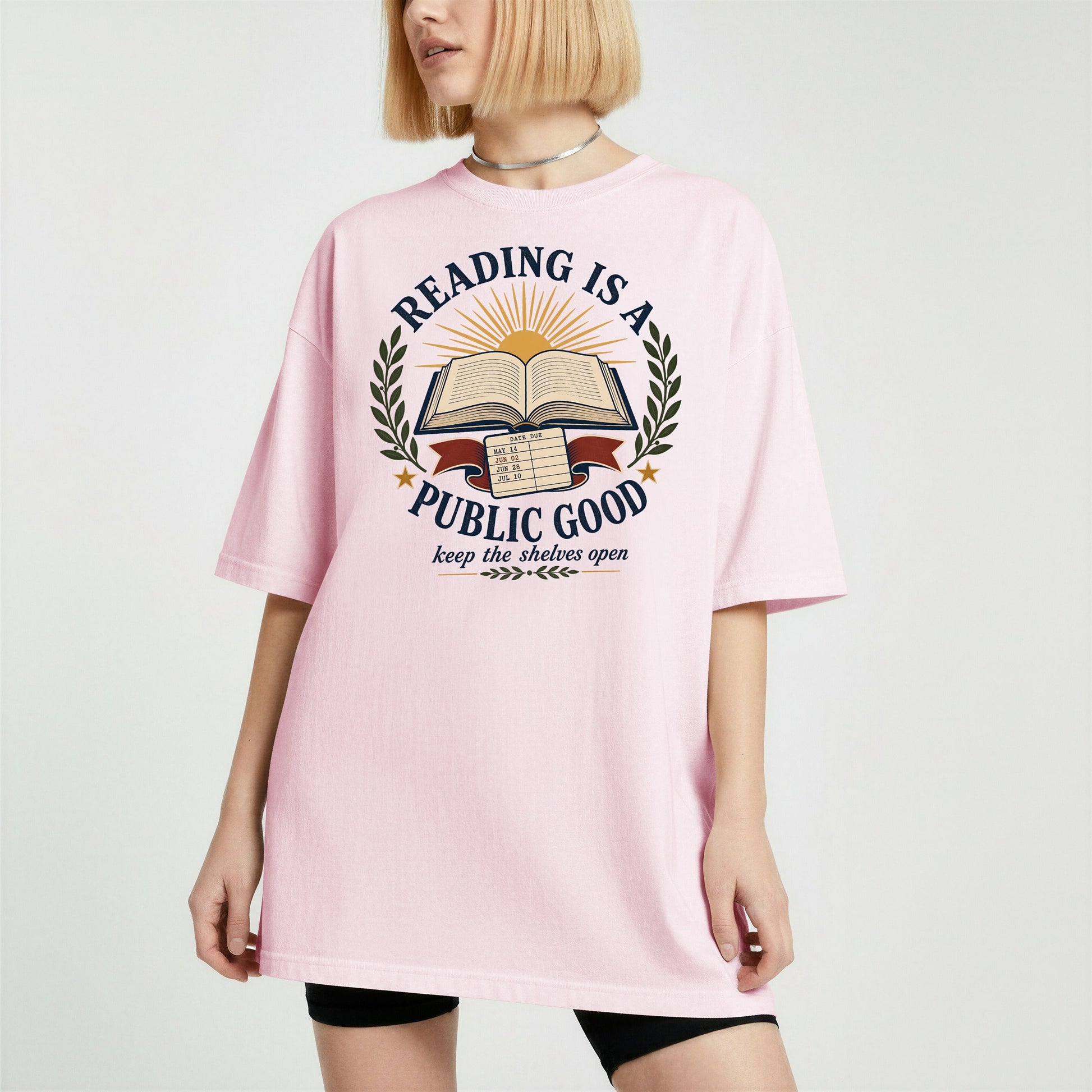 Reading Is a Public Good bookish tee in Blossom, worn