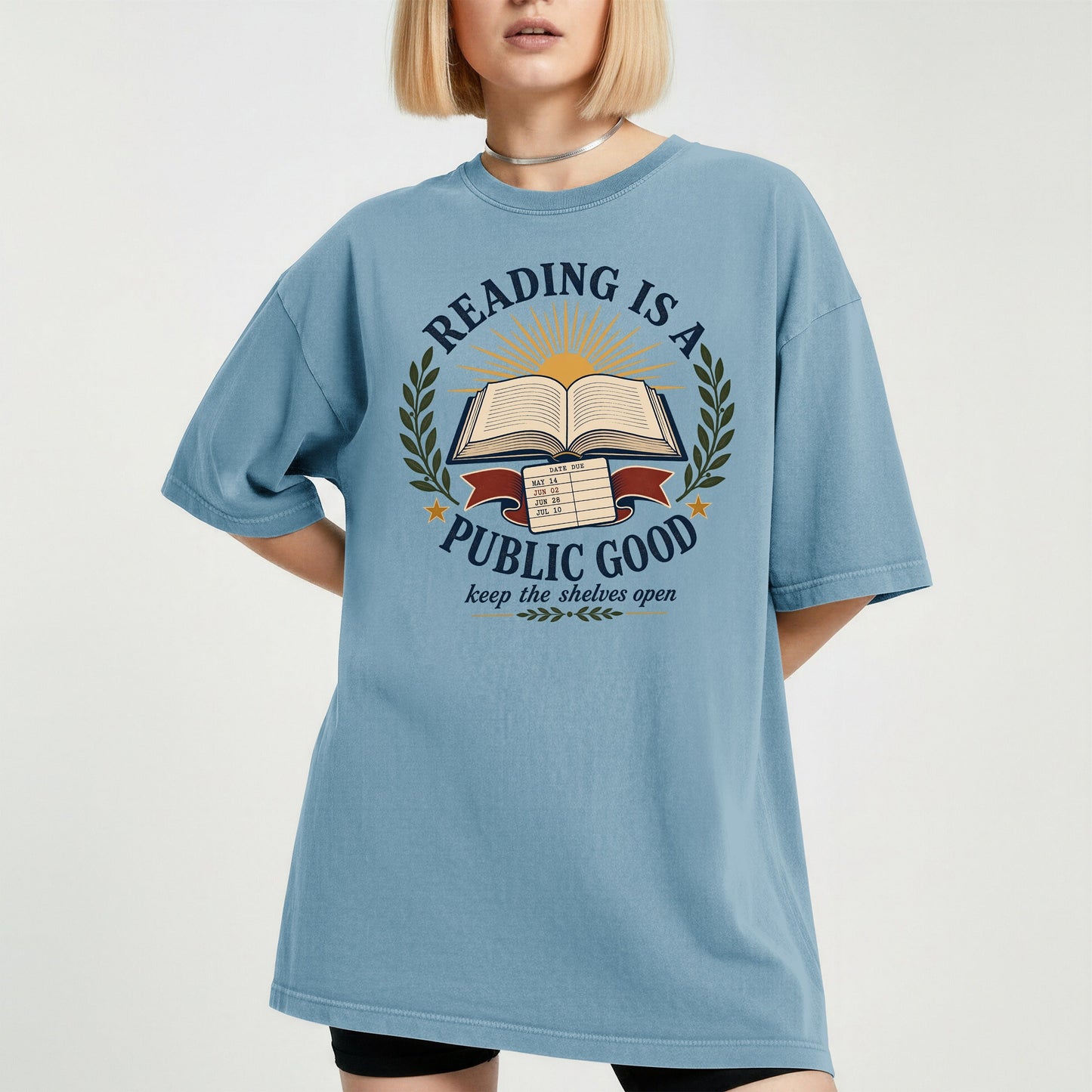 Reading Is a Public Good bookish tee in Ice Blue, worn