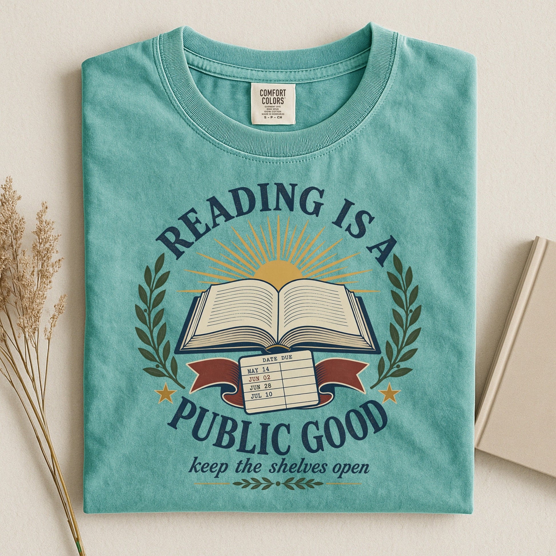 Reading Is a Public Good bookish tee in Seafoam, flat lay