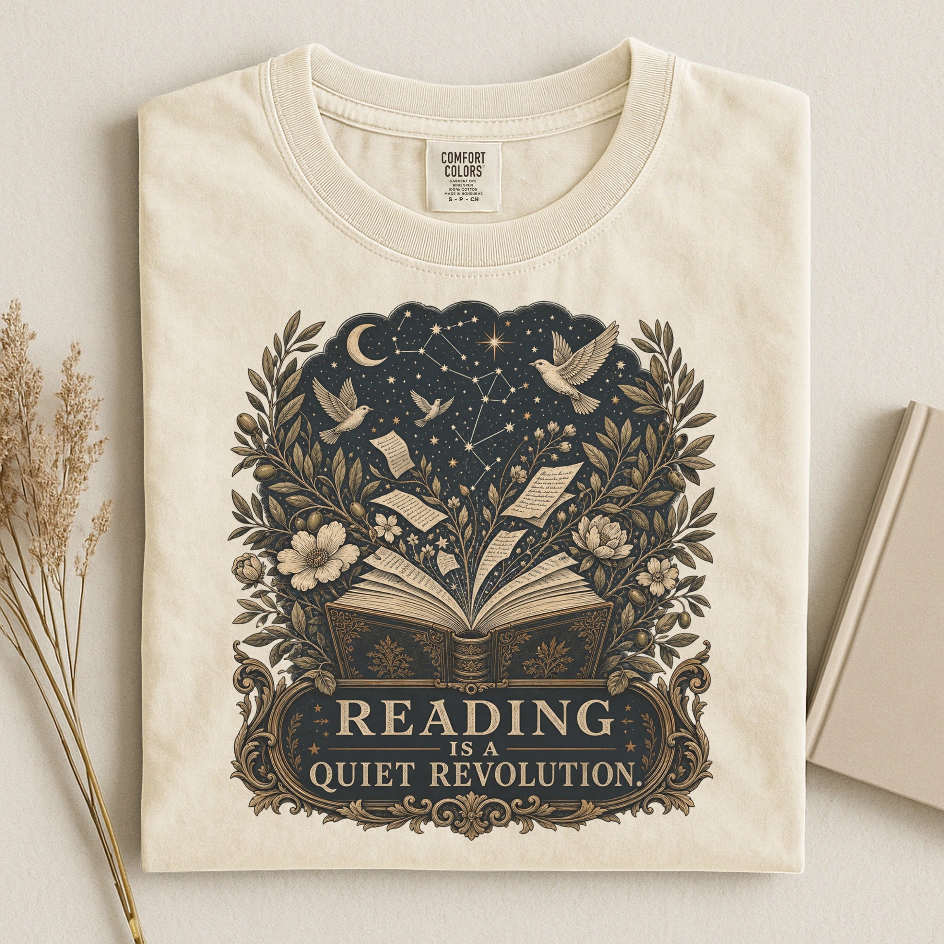 Reading Is a Quiet Revolution bookish tee in Ivory, flat lay