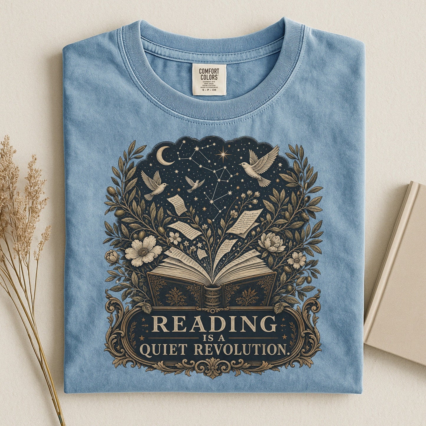 Reading Is a Quiet Revolution bookish tee in Ice Blue, flat lay
