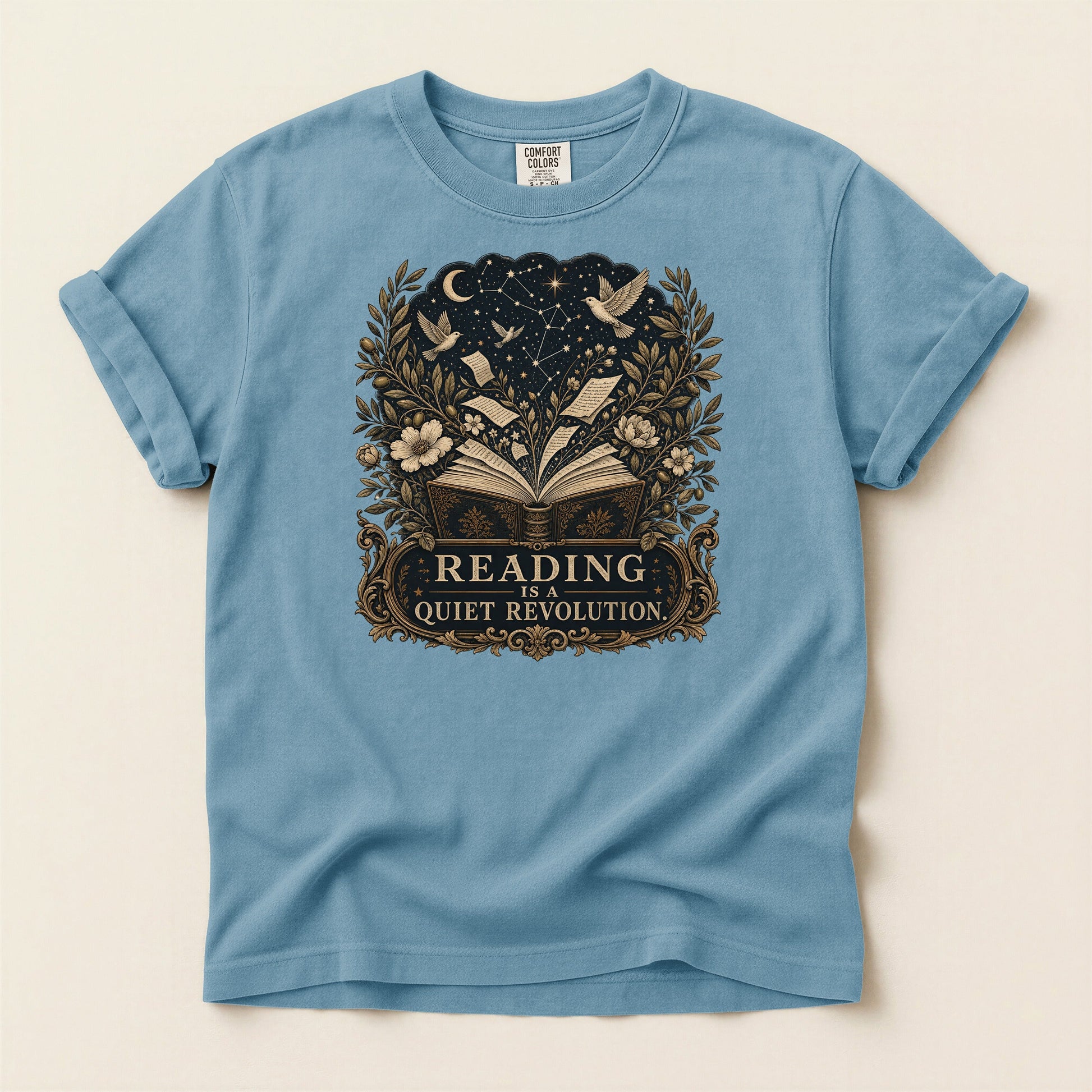 Reading Is a Quiet Revolution bookish tee in Ice Blue, full flat