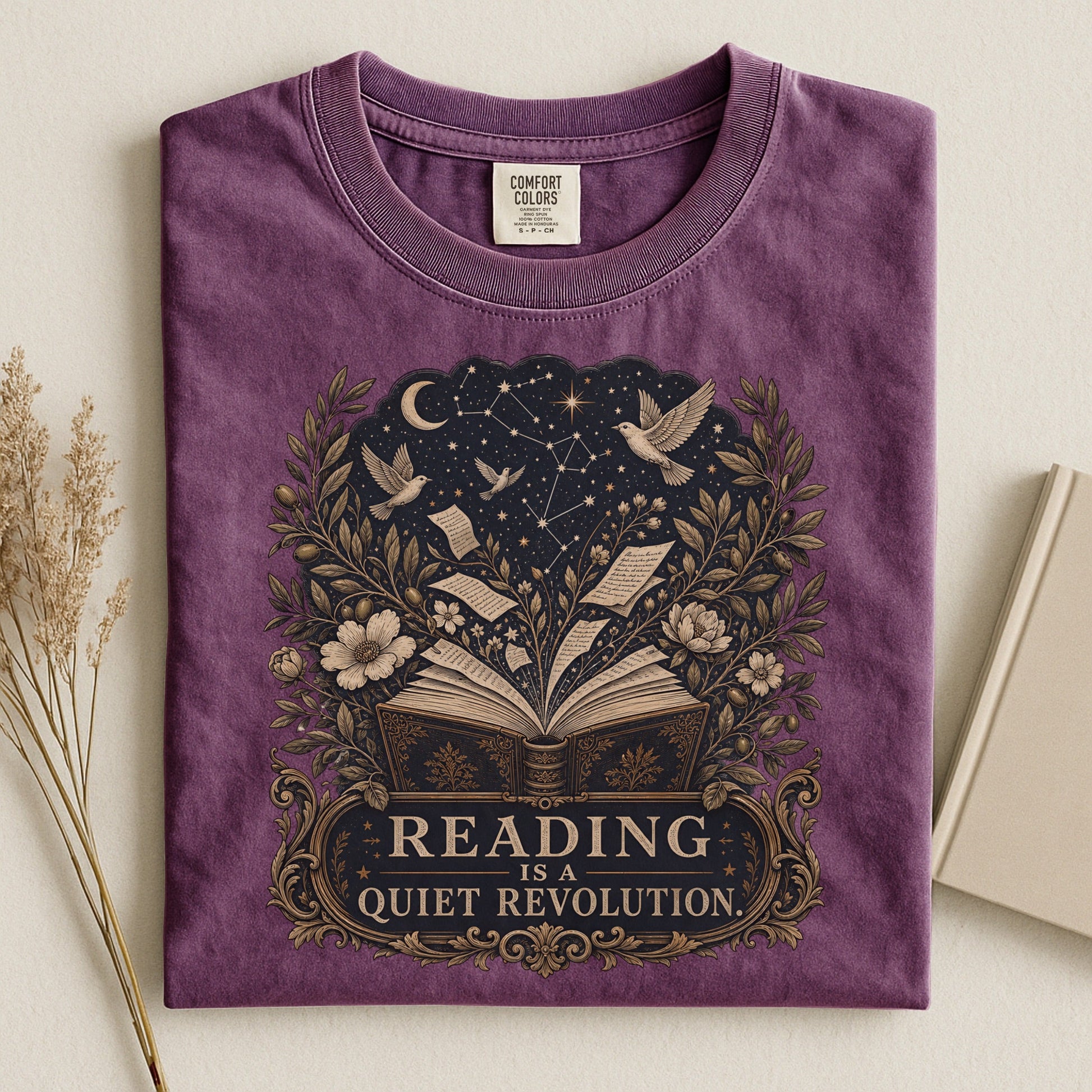 Reading Is a Quiet Revolution bookish tee in Berry, flat lay