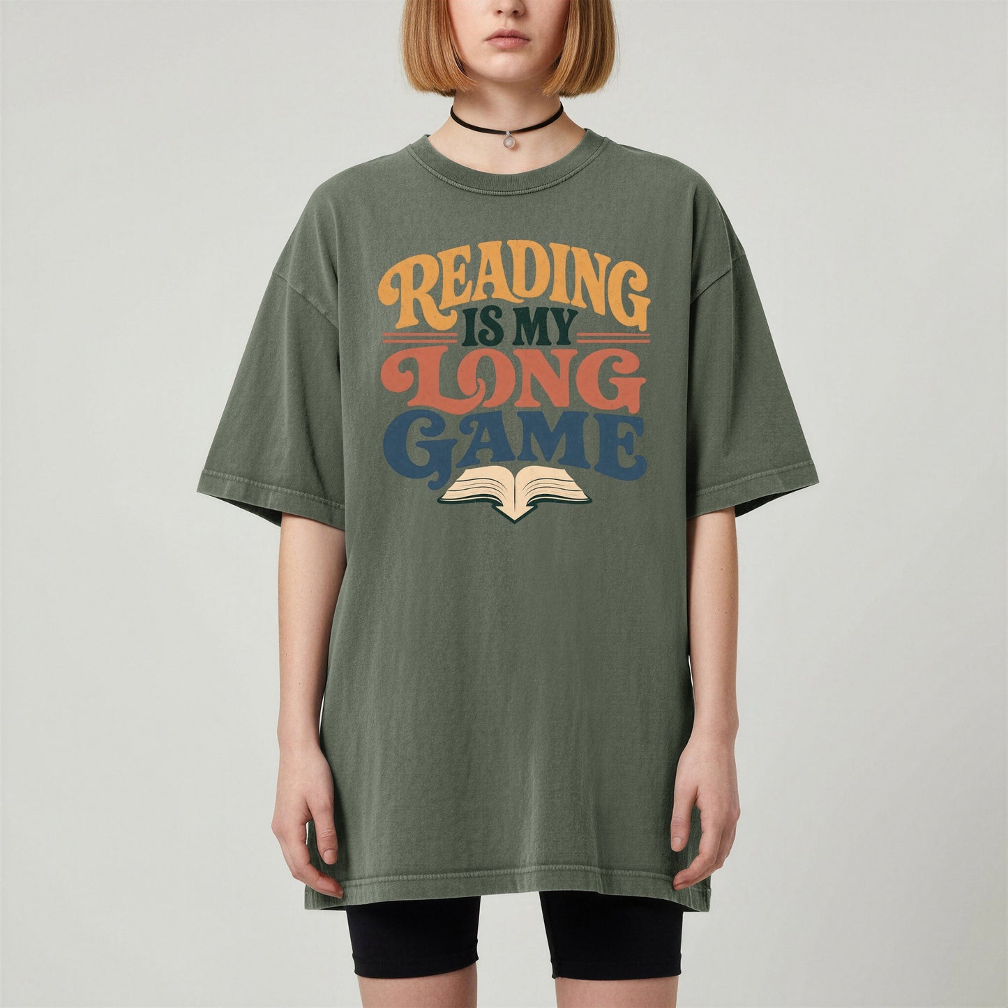 Reading Is My Long Game bookish tee in Moss, worn
